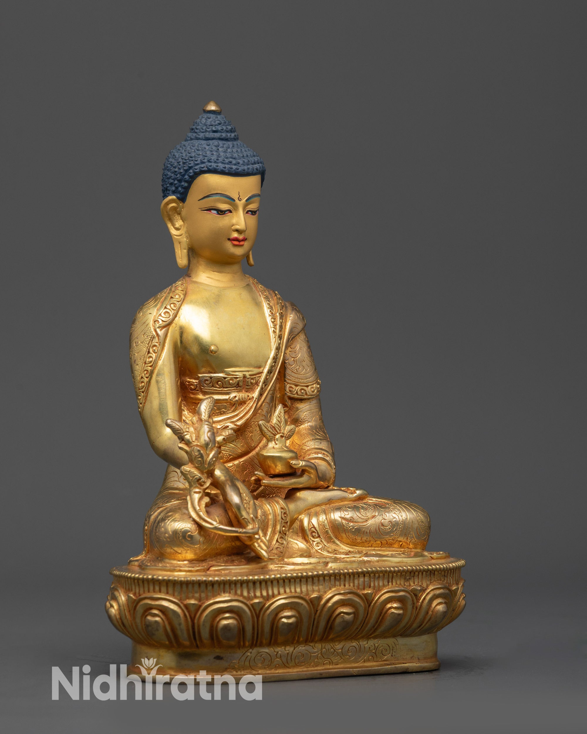 Side view of Nepalese Newari Medicine Buddha statue with myrobalan vase and stem