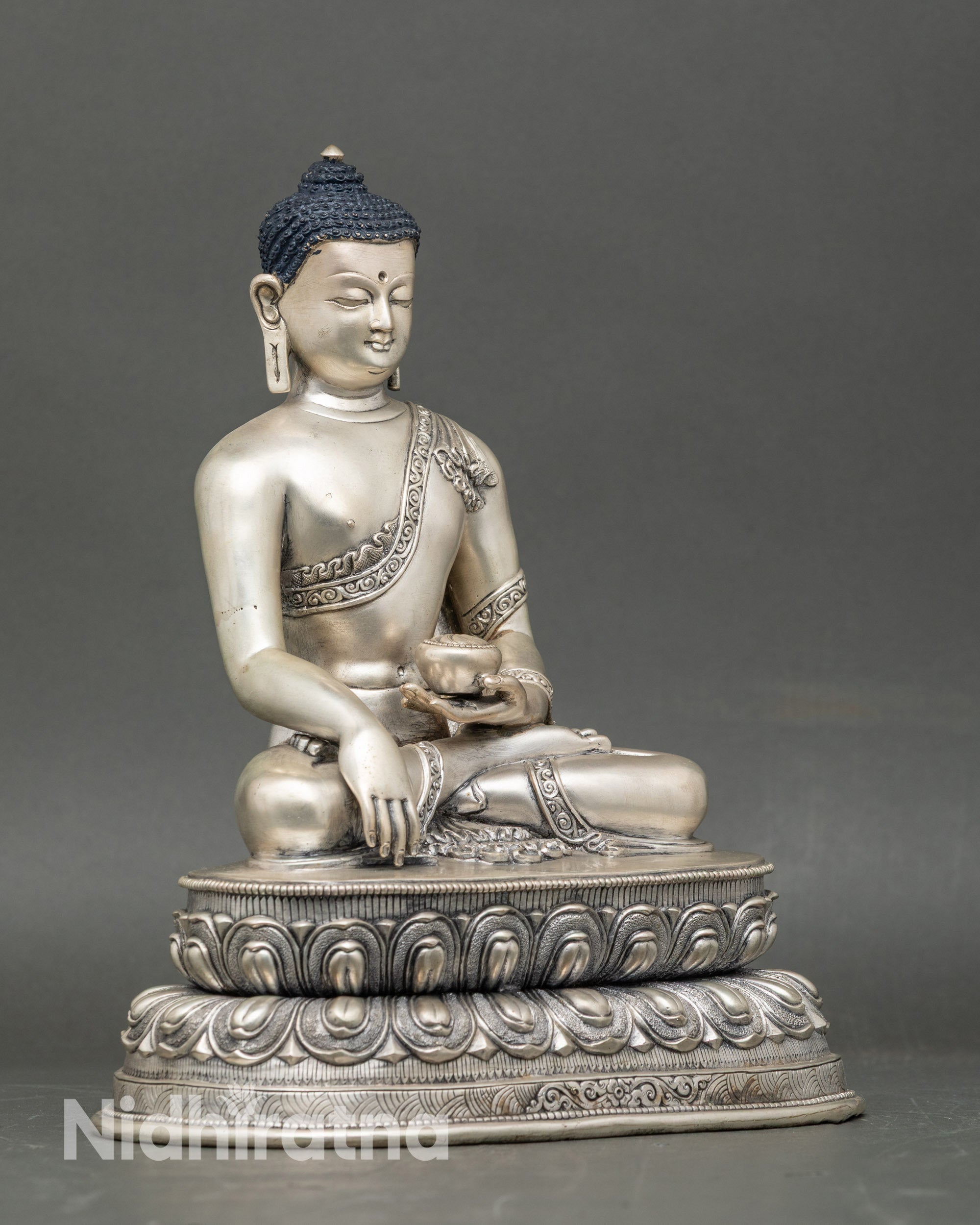 Side view of Nepalese Shakyamuni Buddha statue with vibrant acrylic colors