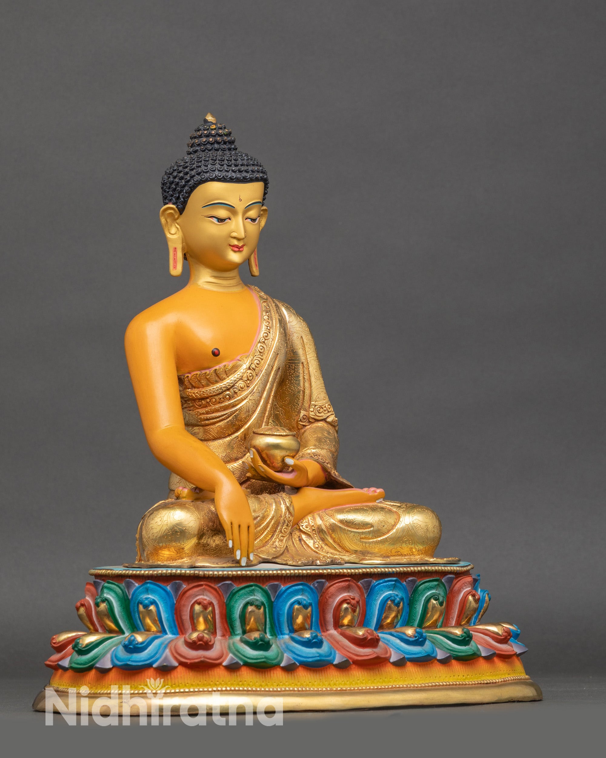 Side view of Nepalese Shakyamuni Buddha statue holding monk’s bowl, traditional lost-wax casting copper artwork