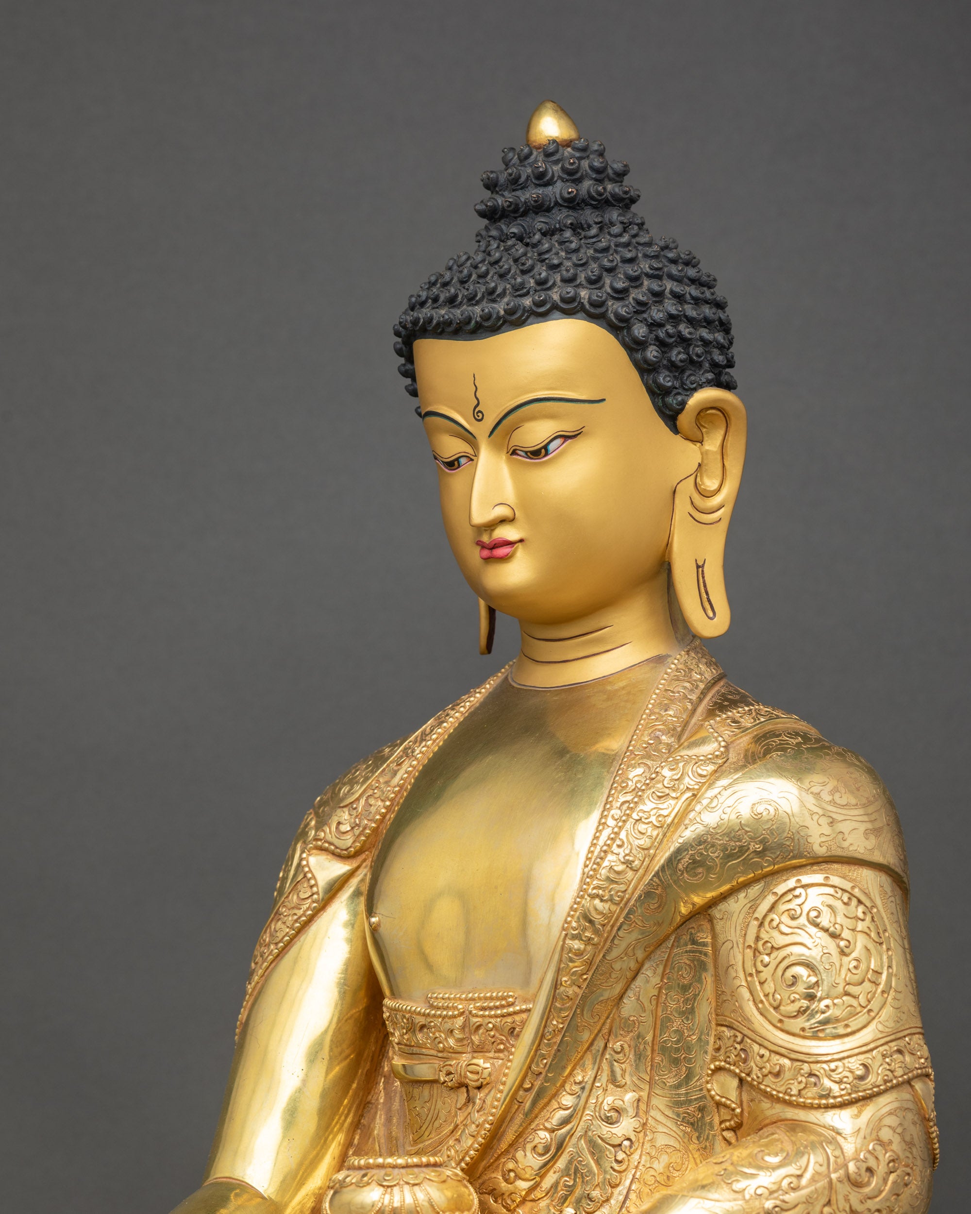 Side view of Shakyamuni Buddha Figurine focusing on robe – Handcrafted Nepalese copper alloy statue