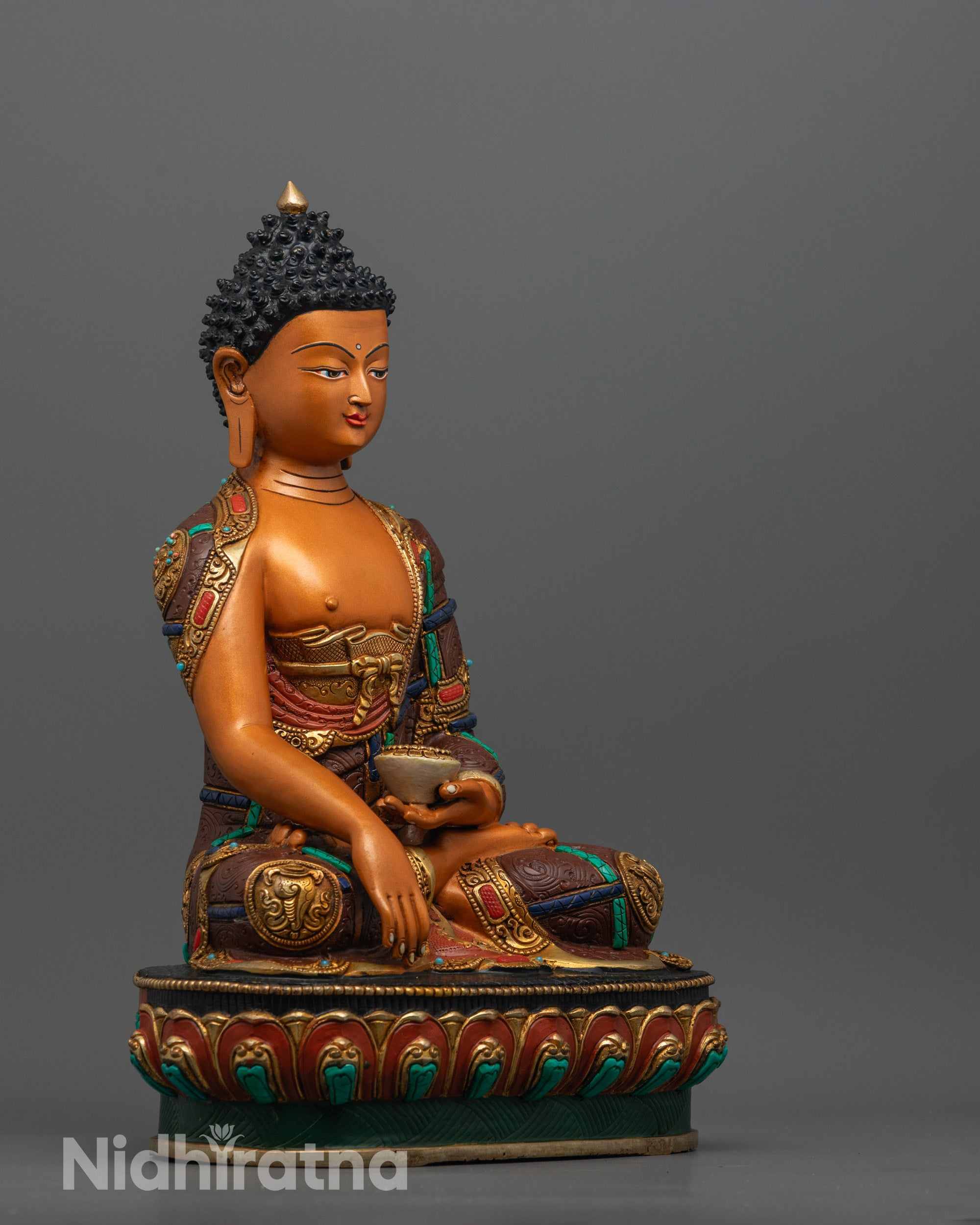 Side view of Shakyamuni Buddha Statue showing lotus base, detailed robe patterns