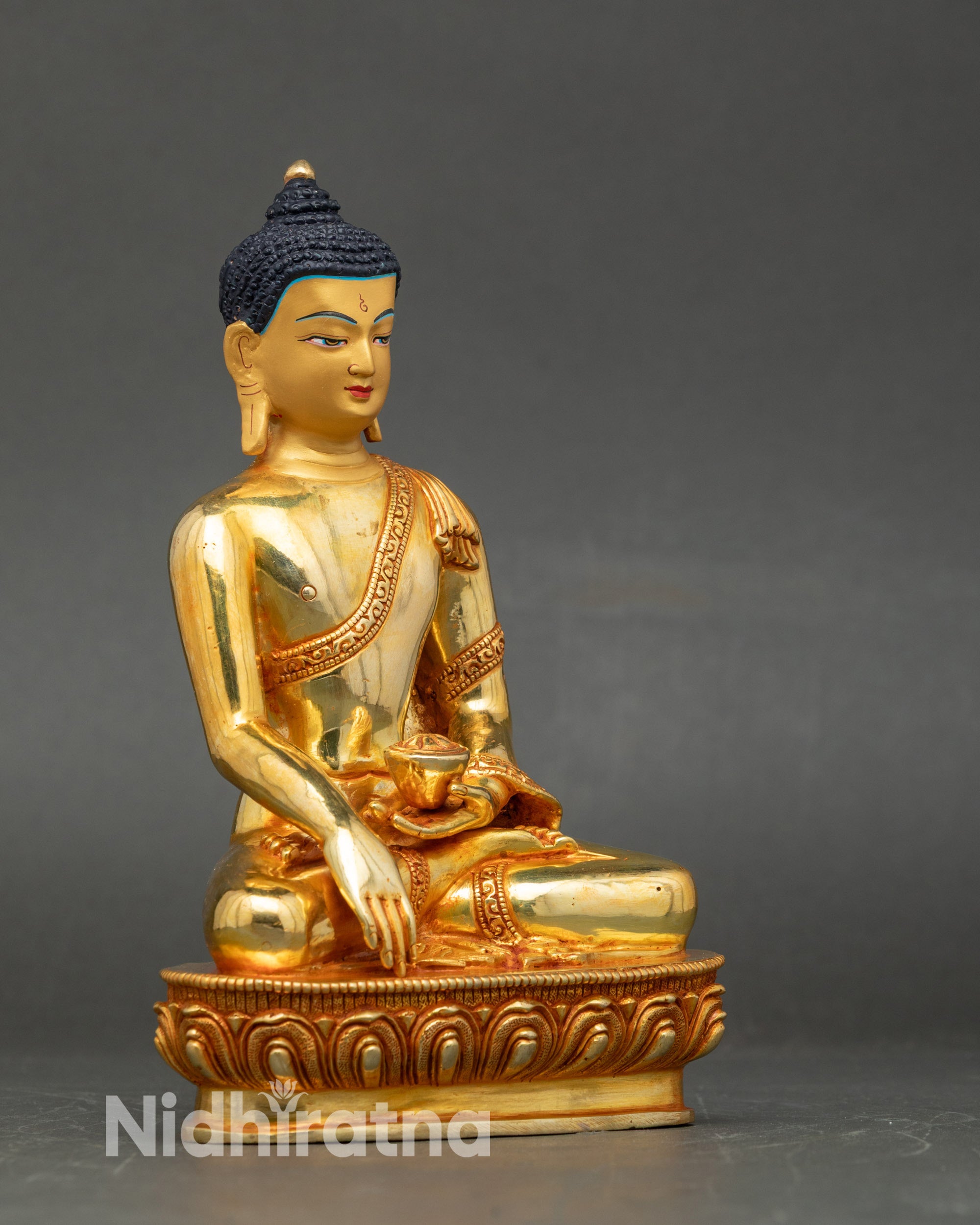 Side view of Shakyamuni Buddha holding monk’s bowl, handcrafted Nepalese lost-wax sculpture