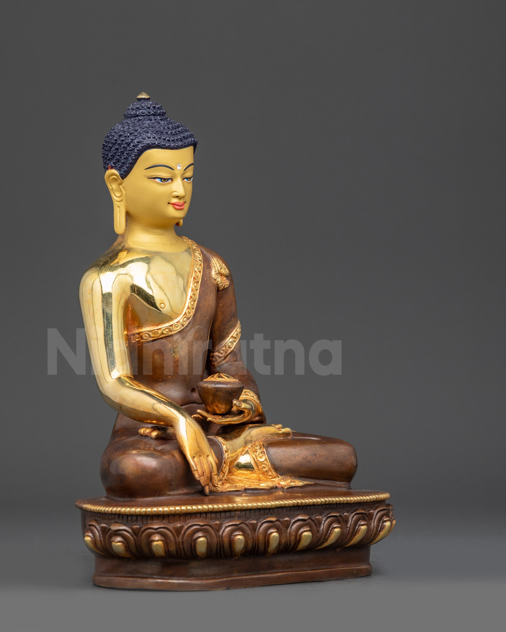 Side view of Shakyamuni Buddha holding monk’s bowl lotus seat gold fire-gilded statue