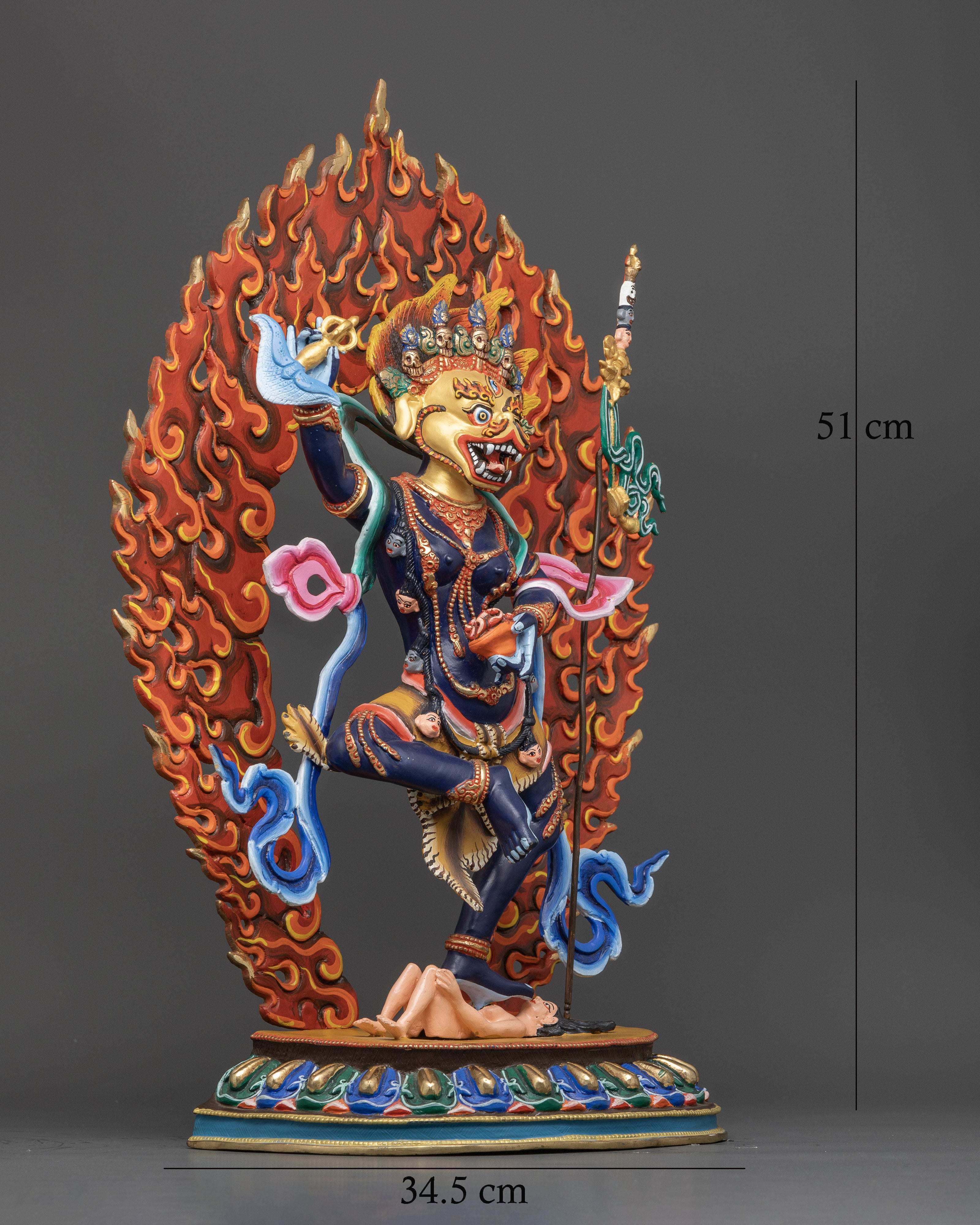 Side view of Simhamukha Statue highlighting copper body and luxurious gold coating