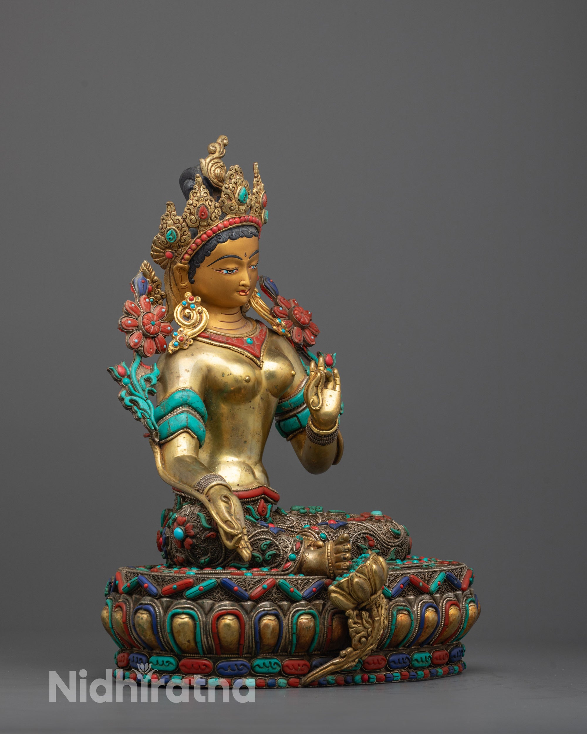 Side view of Traditional Himalayan Green Tara Sculpture made from copper featuring