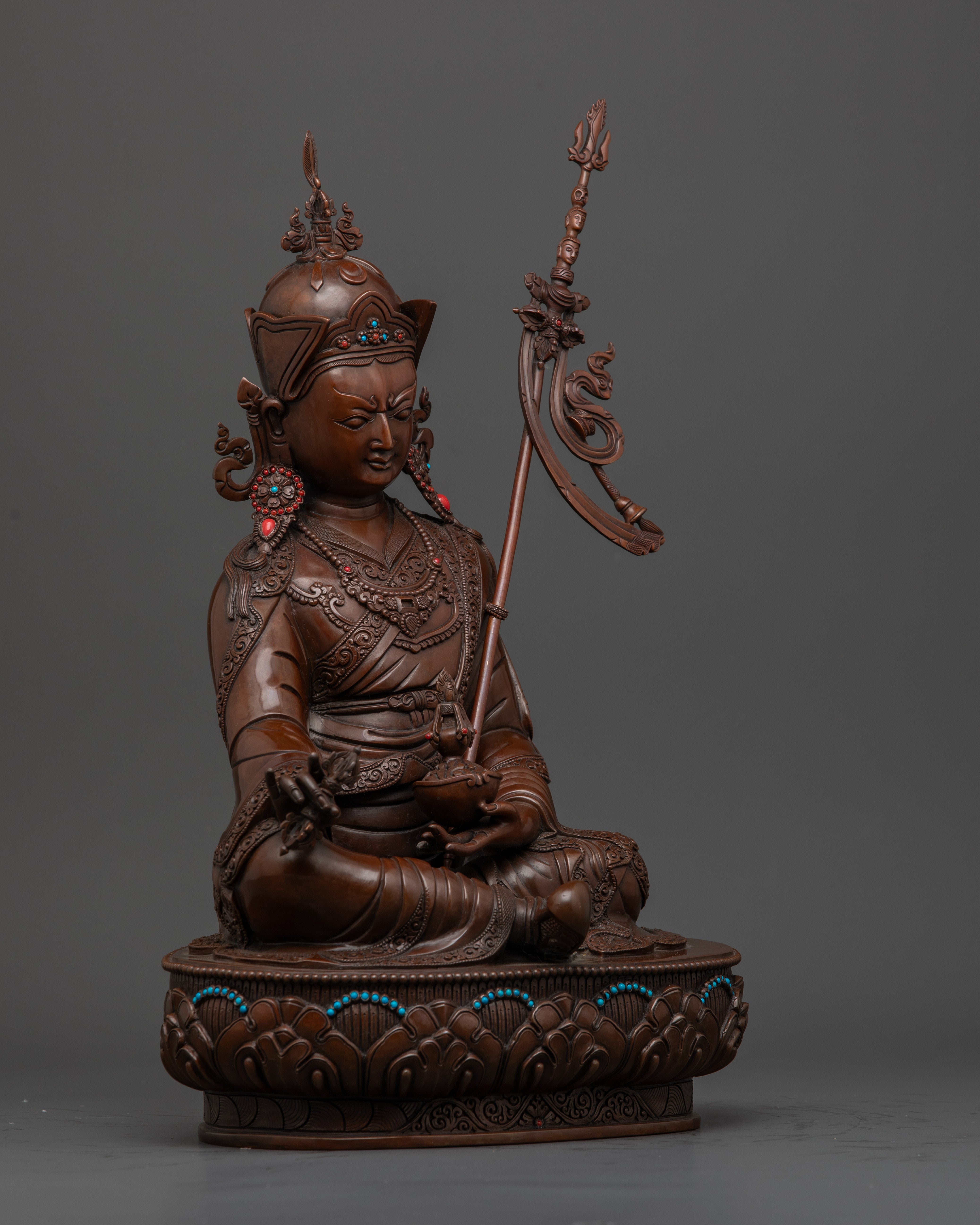 Side view of Traditional Himalayan Guru Rinpoche sculpture with detailed carvings