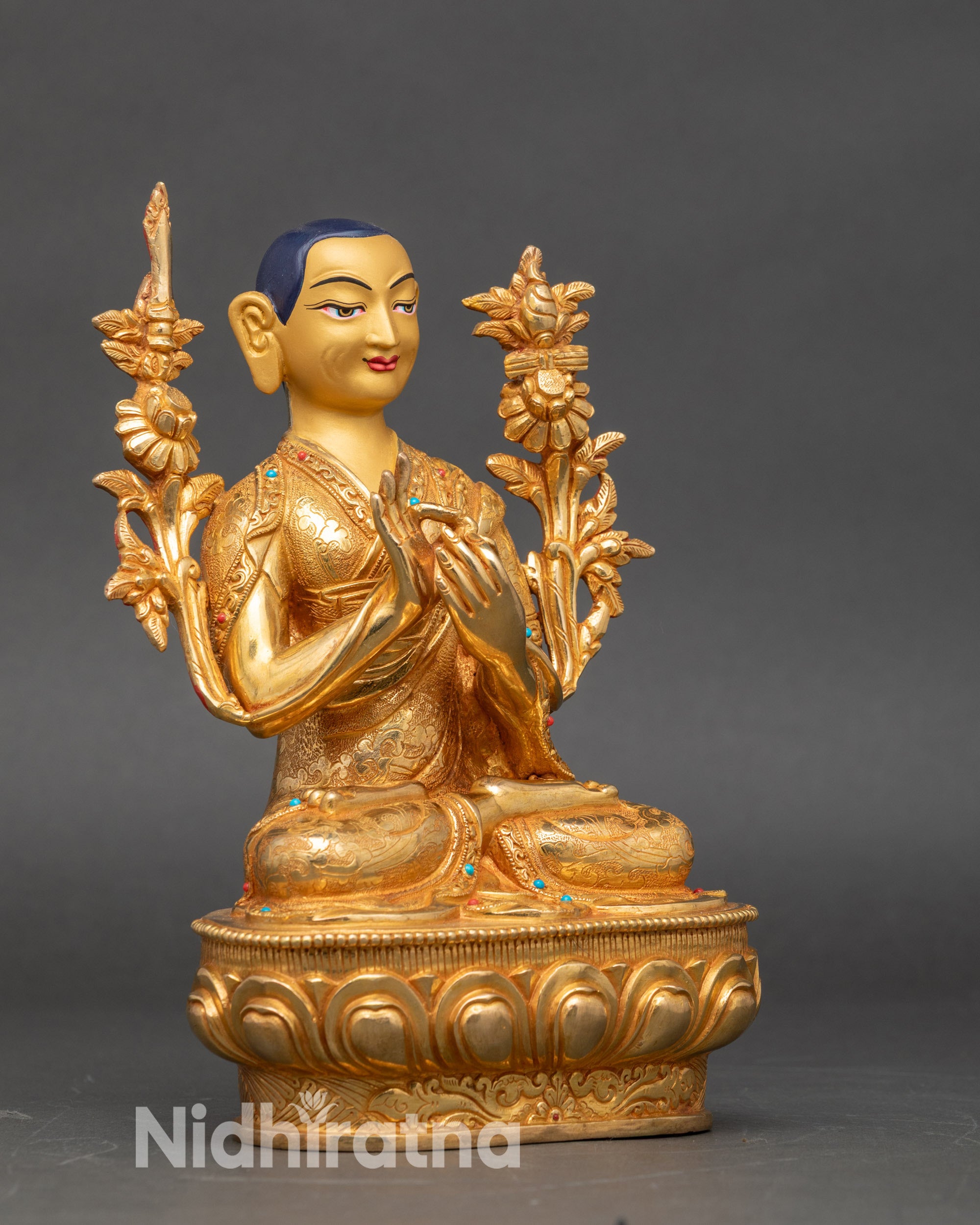 Side view of Tsongkhapa statue on lotus base, traditional lost-wax cast Nepalese deity set