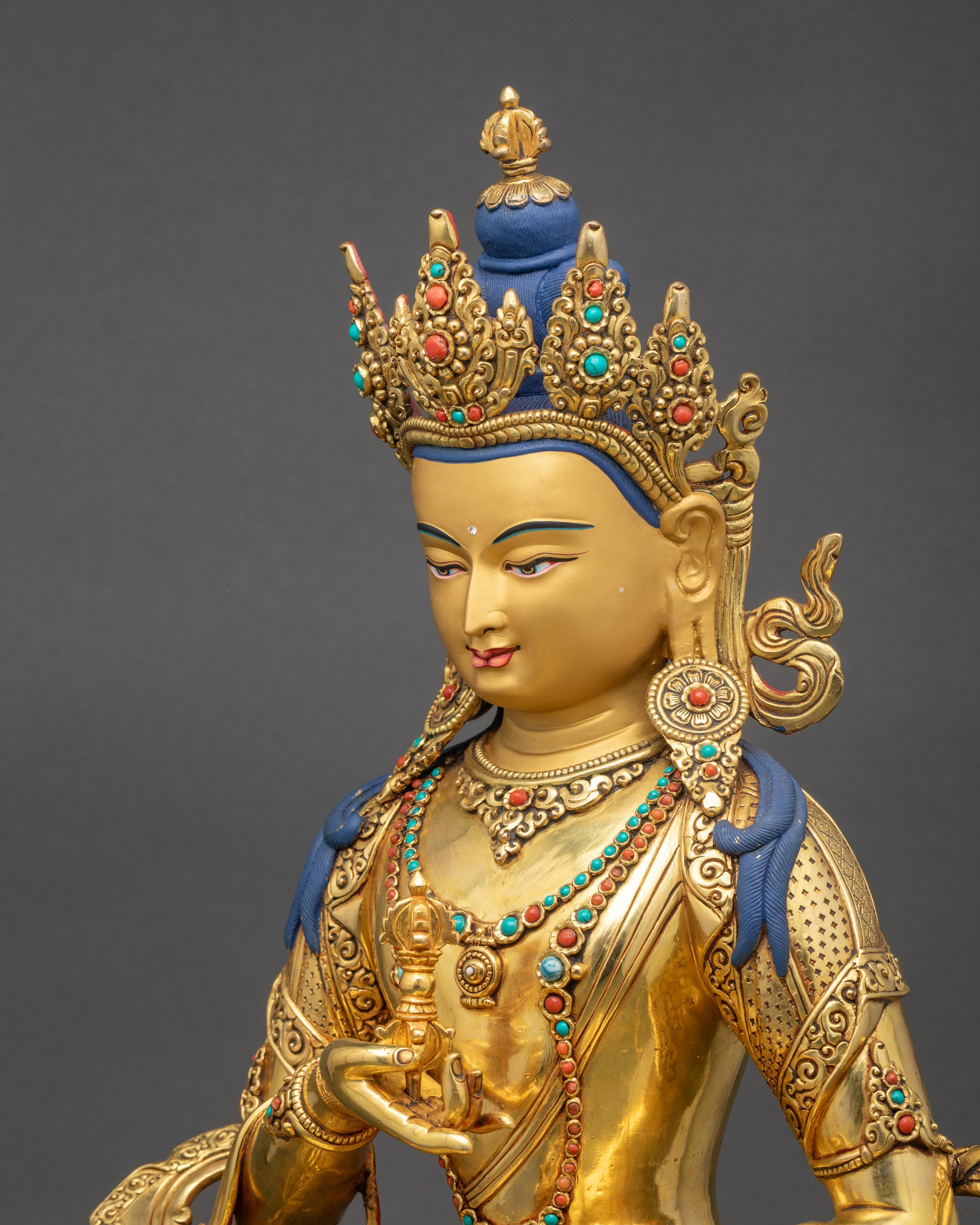 Side view of Vajrasattva statue gold gilded face Nepalese craftsmanship
