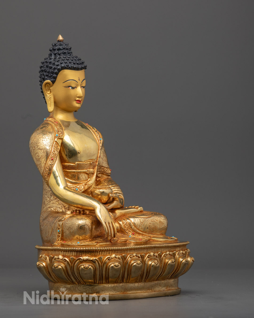 traditional Nepalese Shakyamuni Buddha statue showing intricate hand-carved details and hollow chamber for auspicious mantras.