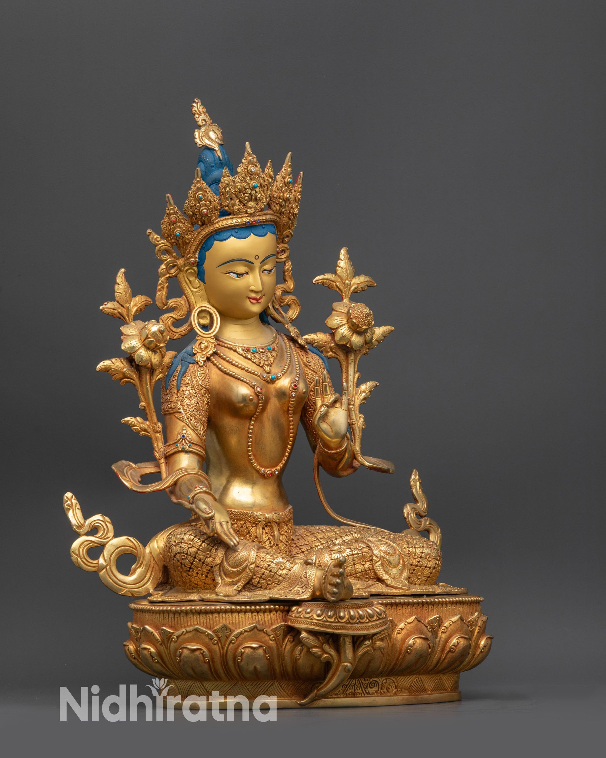 Side view of handcrafted Green Tara statue with flowing robe and semi-precious stones