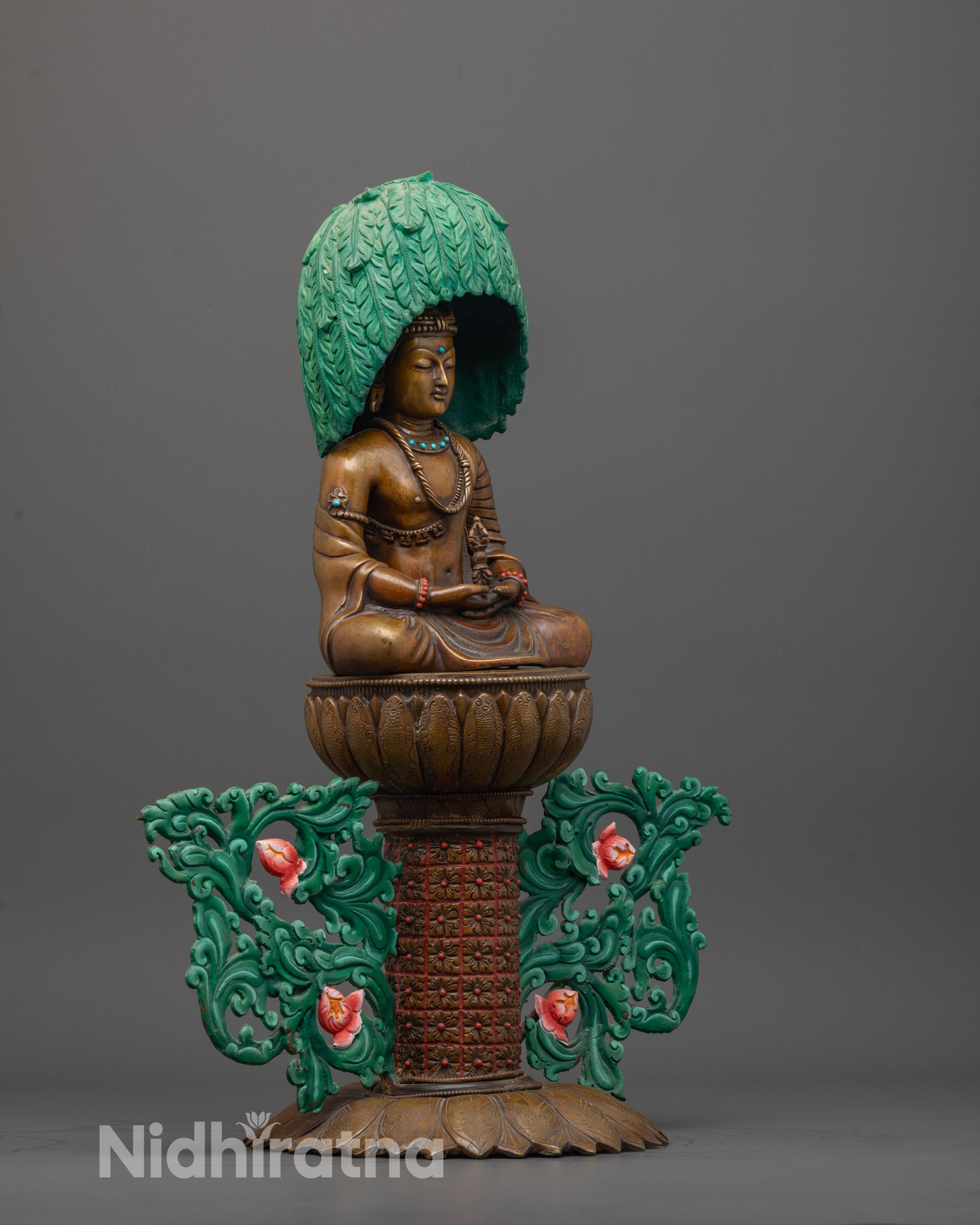 Side view of handcrafted Japanese Mitrugpa statue seated on lotus base holding vajra
