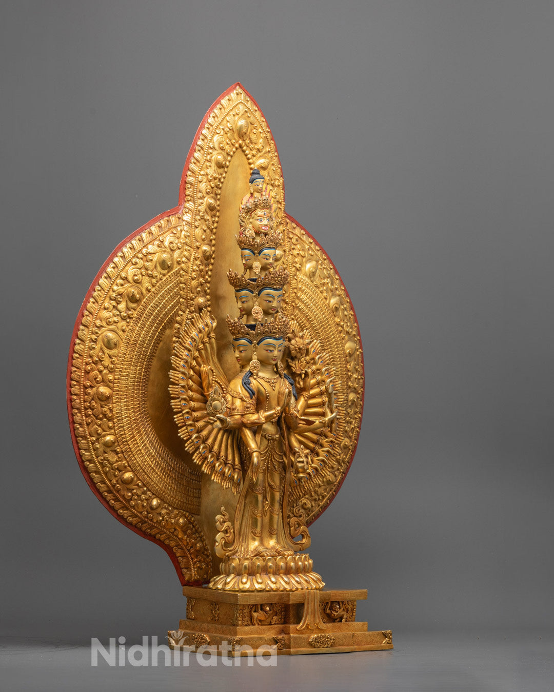 Side view of intricately carved 1000-Armed Chenrezig Statue