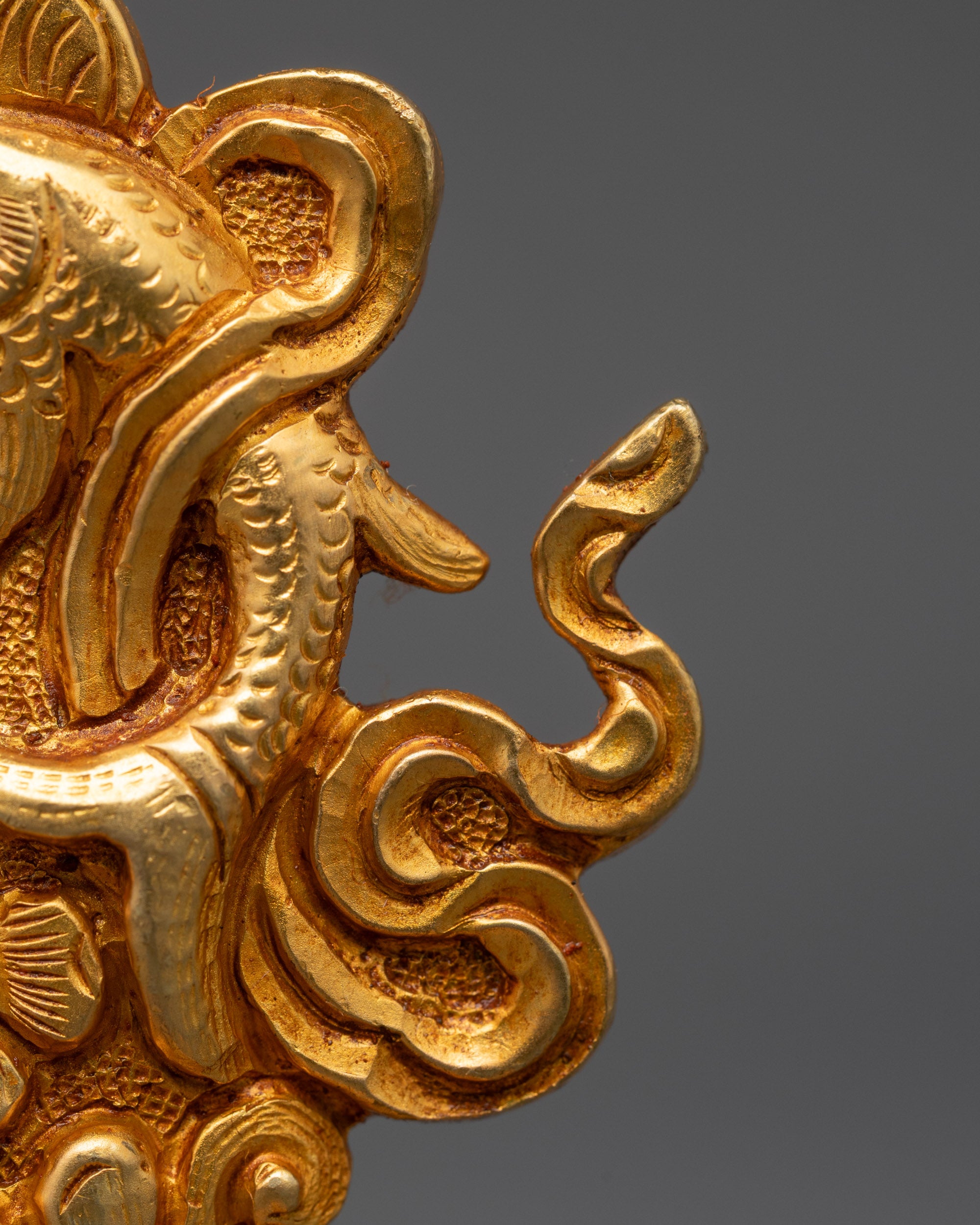 Side view of the Golden Fish symbol from the handcrafted Tibetan Buddhist Ashtamangala set