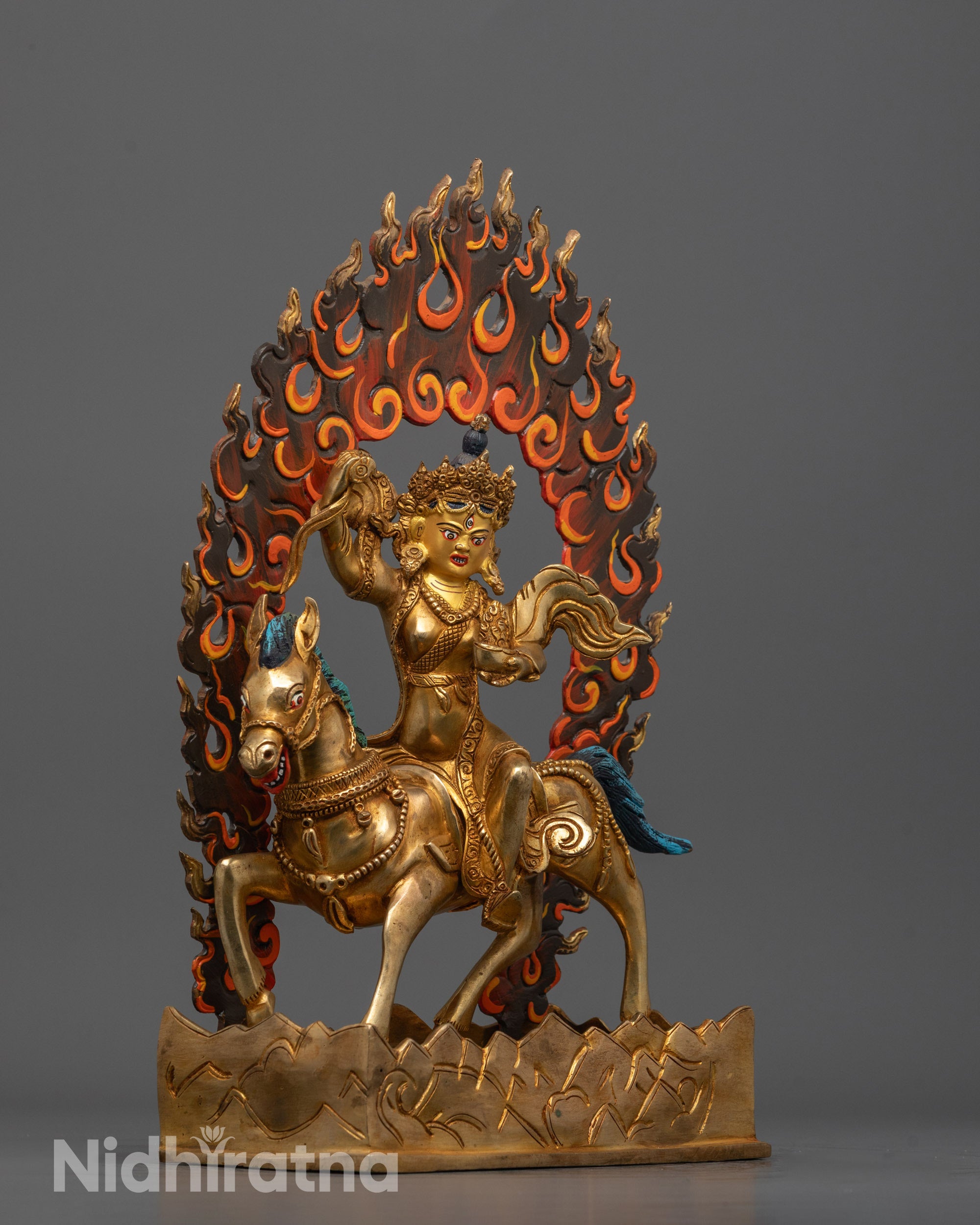 Side view showing detailed jewelry and carved patterns on horse of Achi Chokyi Drolma statue
