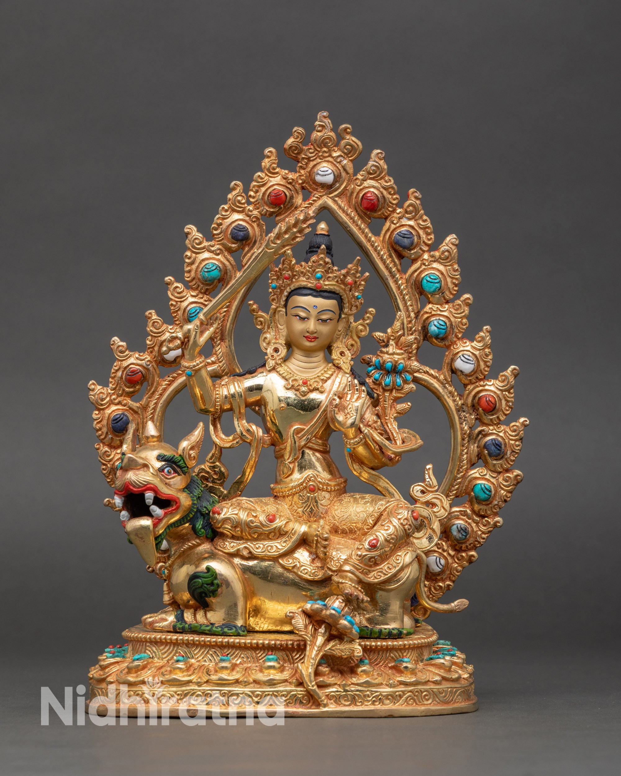 Simhada Manjushri statue on lion throne with copper and gold fire-gilded details