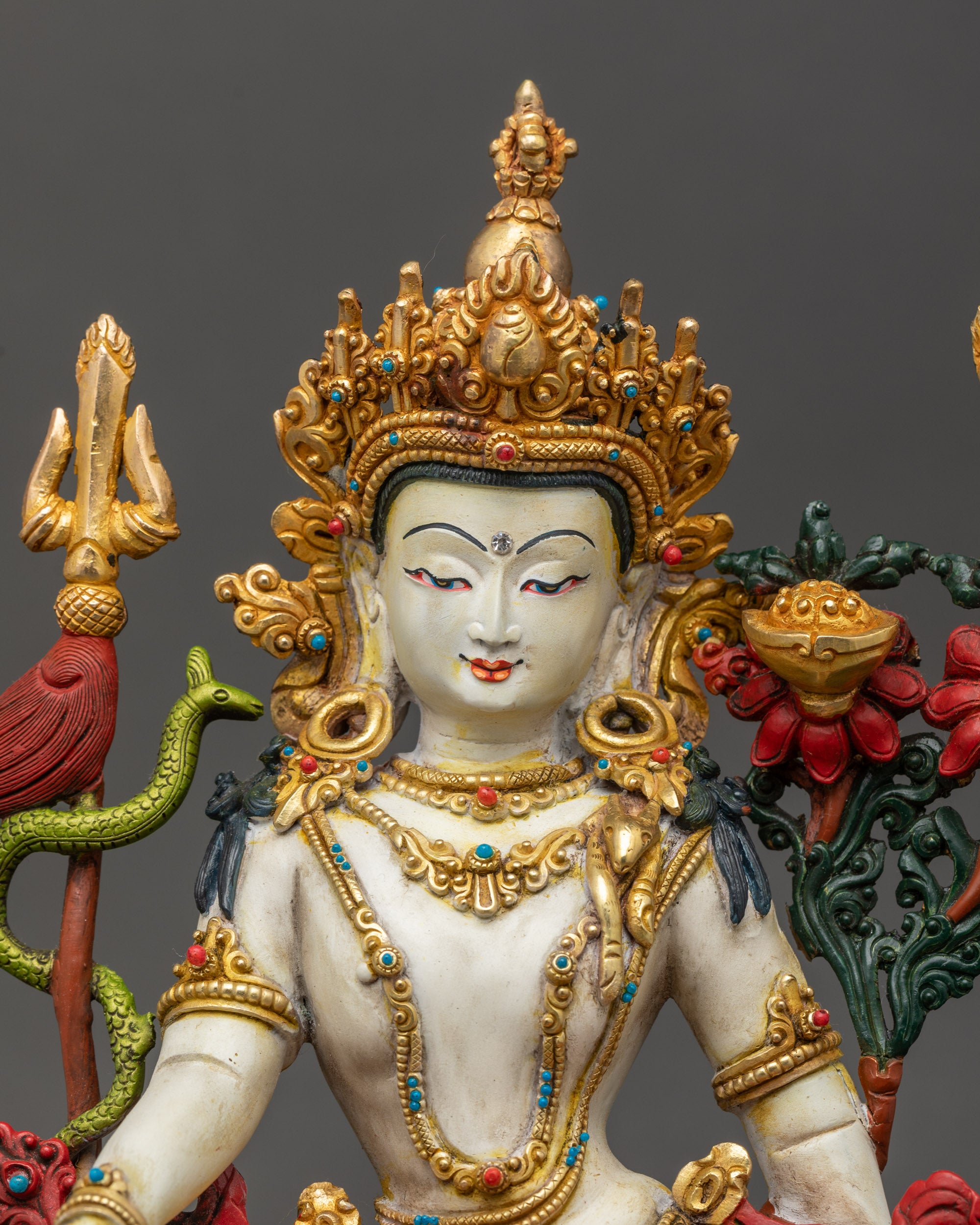 Simhanada Chenrezig Statue close up showing gold-gilded face and jewelry details