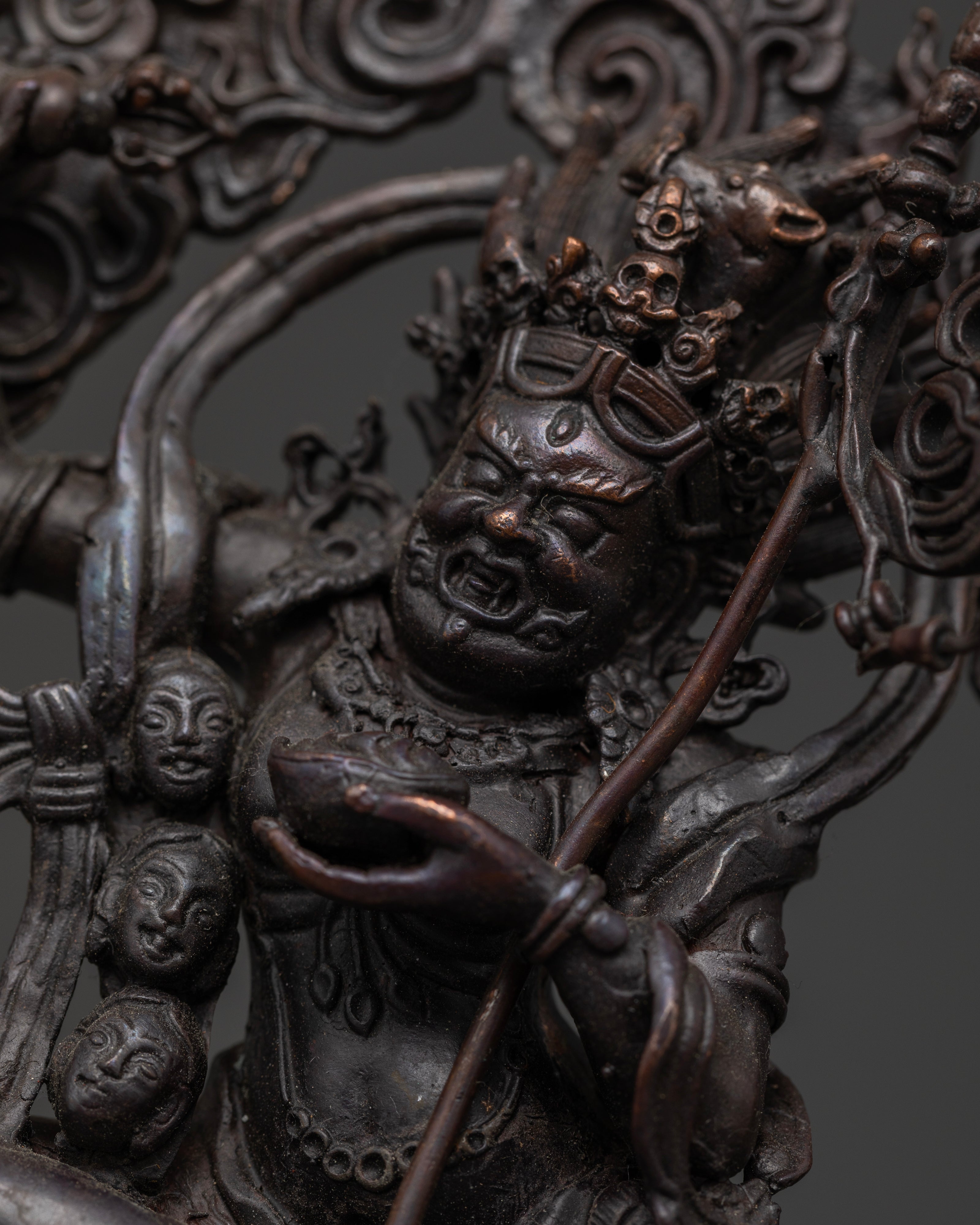 Close up of Dorje Phagmo statue highlighting detailed oxidized craftsmanship