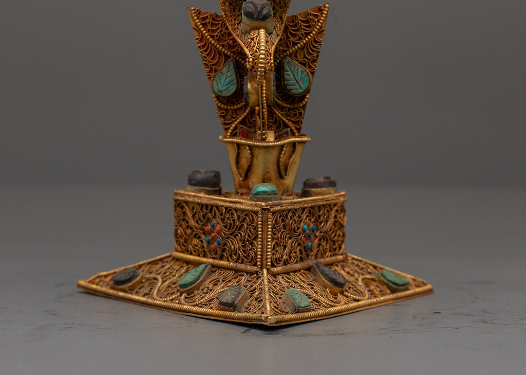 Rear close-up of copper Phurba ritual dagger with semi-precious stones and acrylic paint