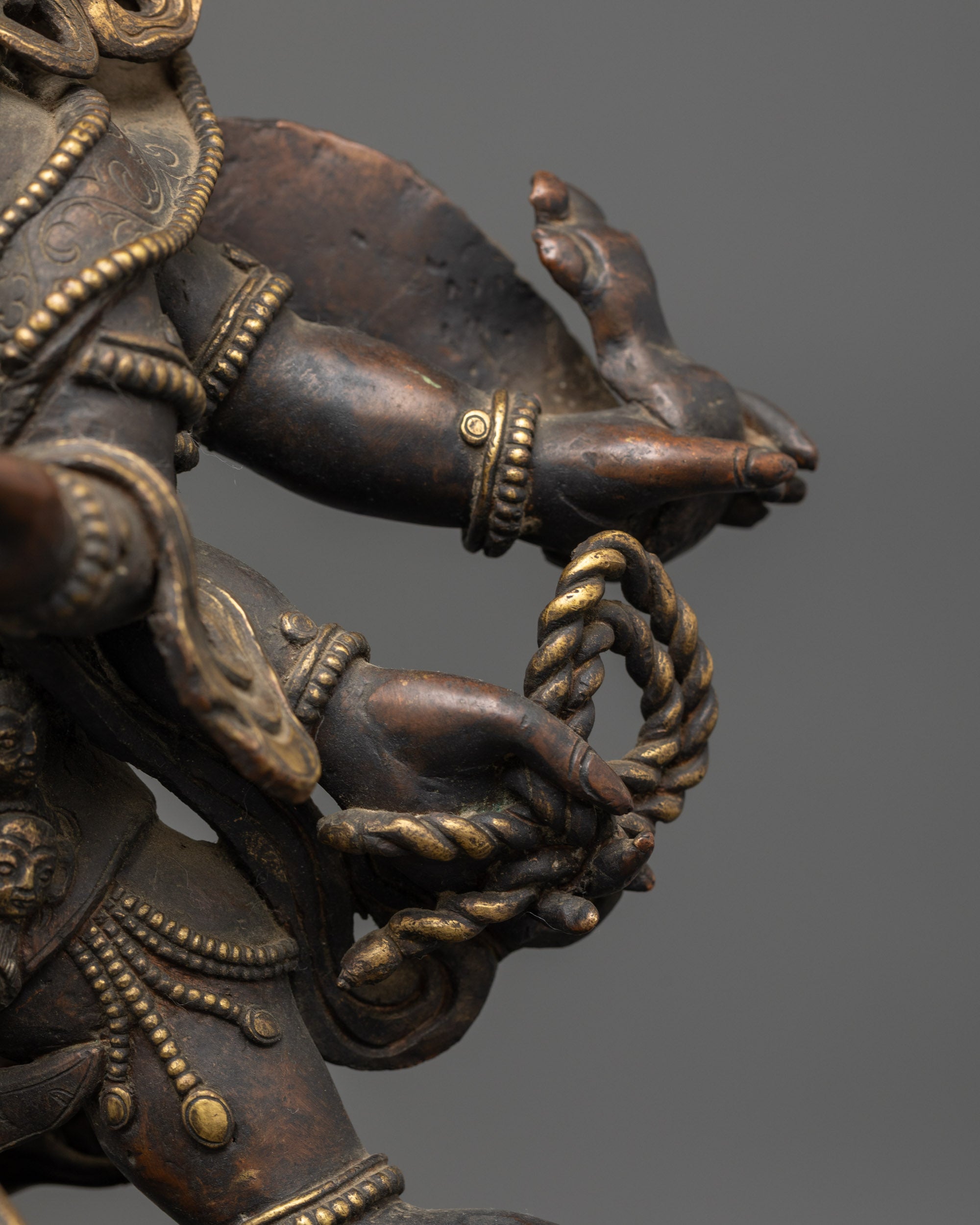 Six-Armed Mahakala holding sacred kartika, skull cup, and damaru, symbolizing spiritual protection and the blessing of power.