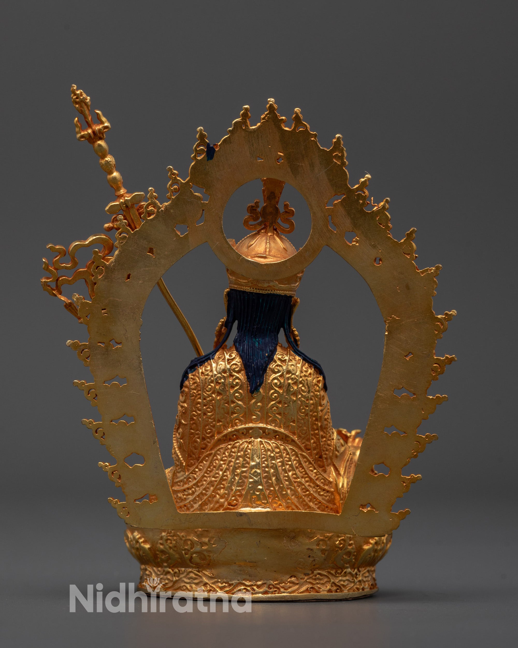 Spiritual Guru Rinpoche statue placed on meditation altar featuring lotus base