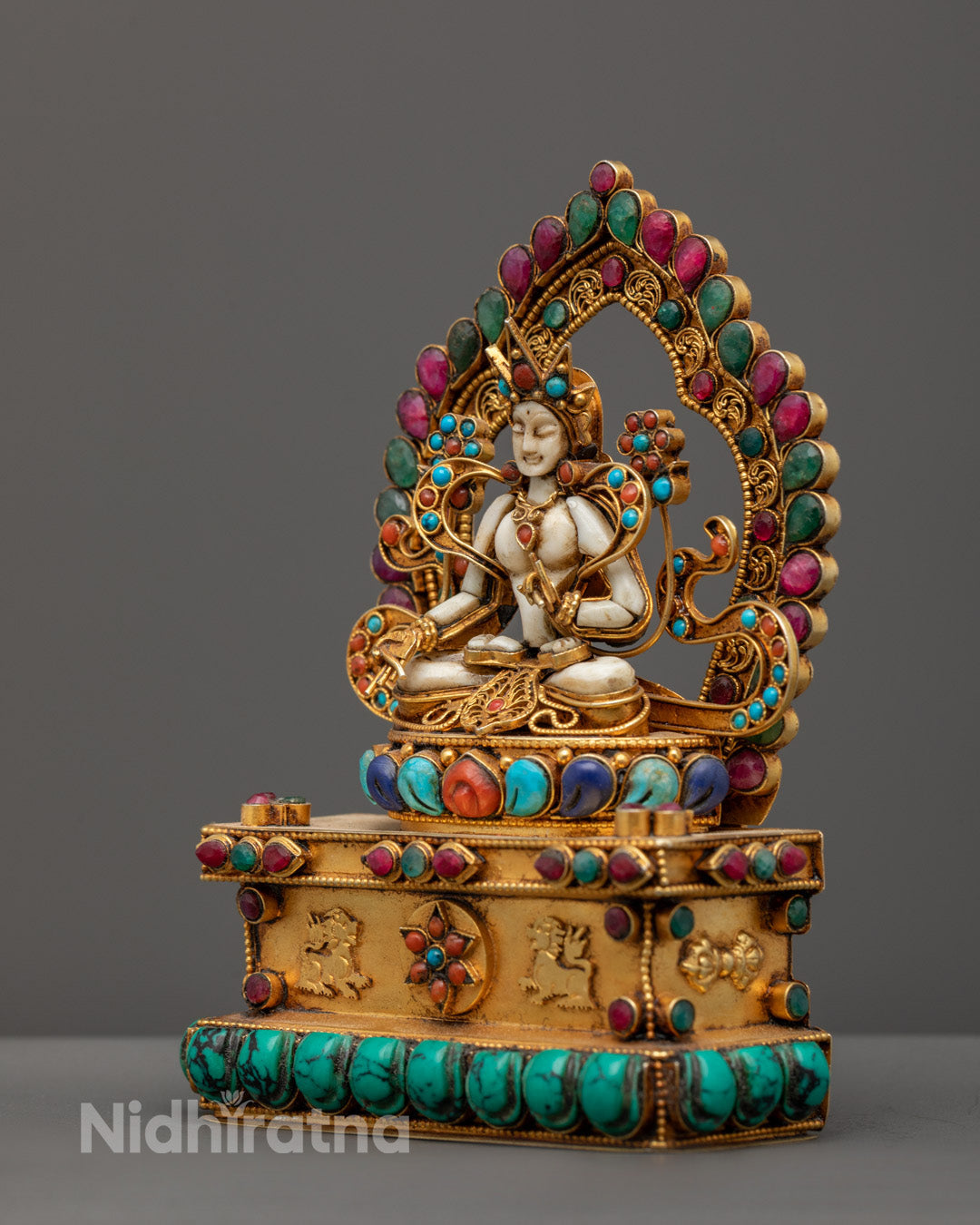 Spiritual meditation statue symbolizing compassion longevity and protection with radiant gold finish and authentic stone embellishments