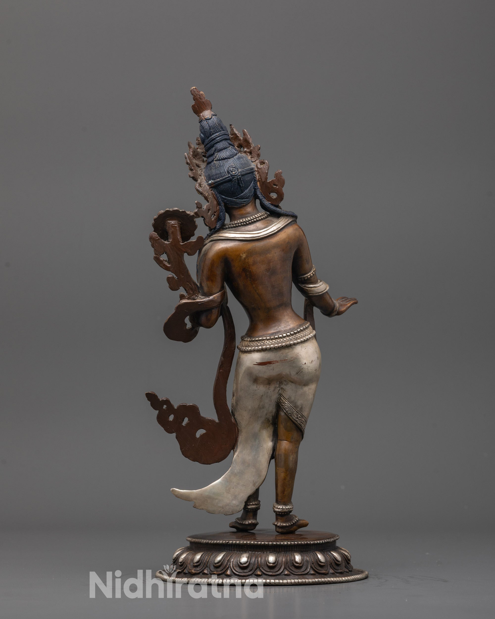 Back view of oxidized copper Green Tara statue showing detailed silver plating and craftsmanship