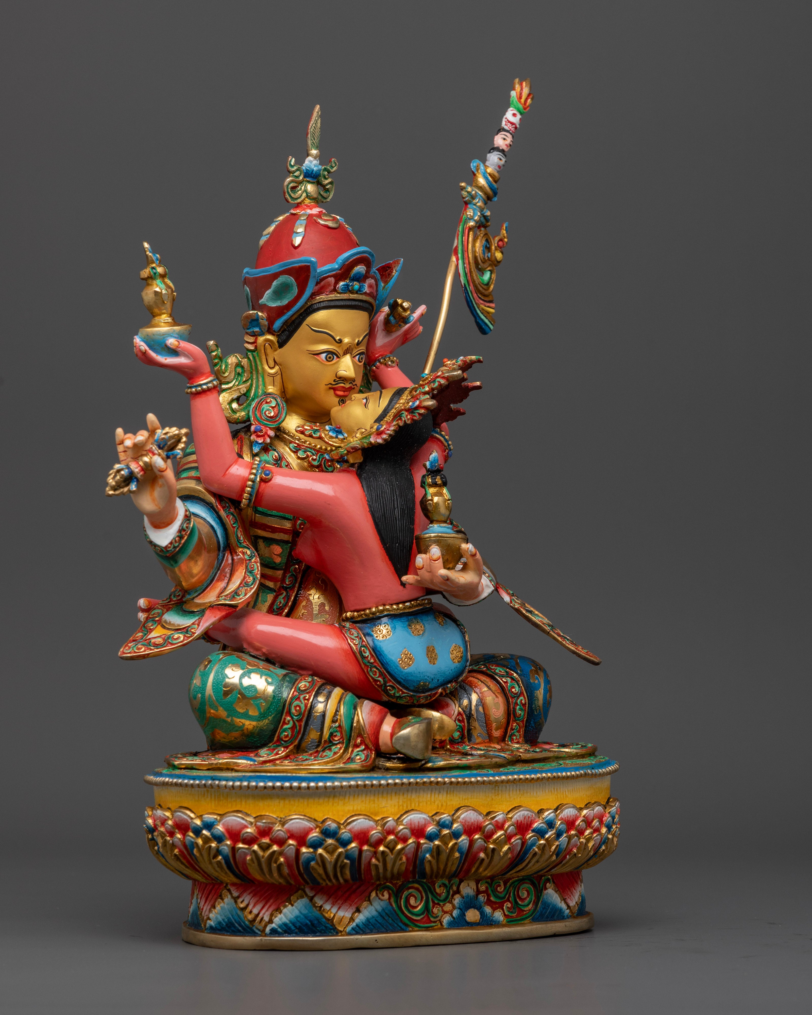The 33.5cm tall Guru Rinpoche with Consort statue, showcasing vivid acrylic colors, ornate detailing, and traditional Nepalese artistry.