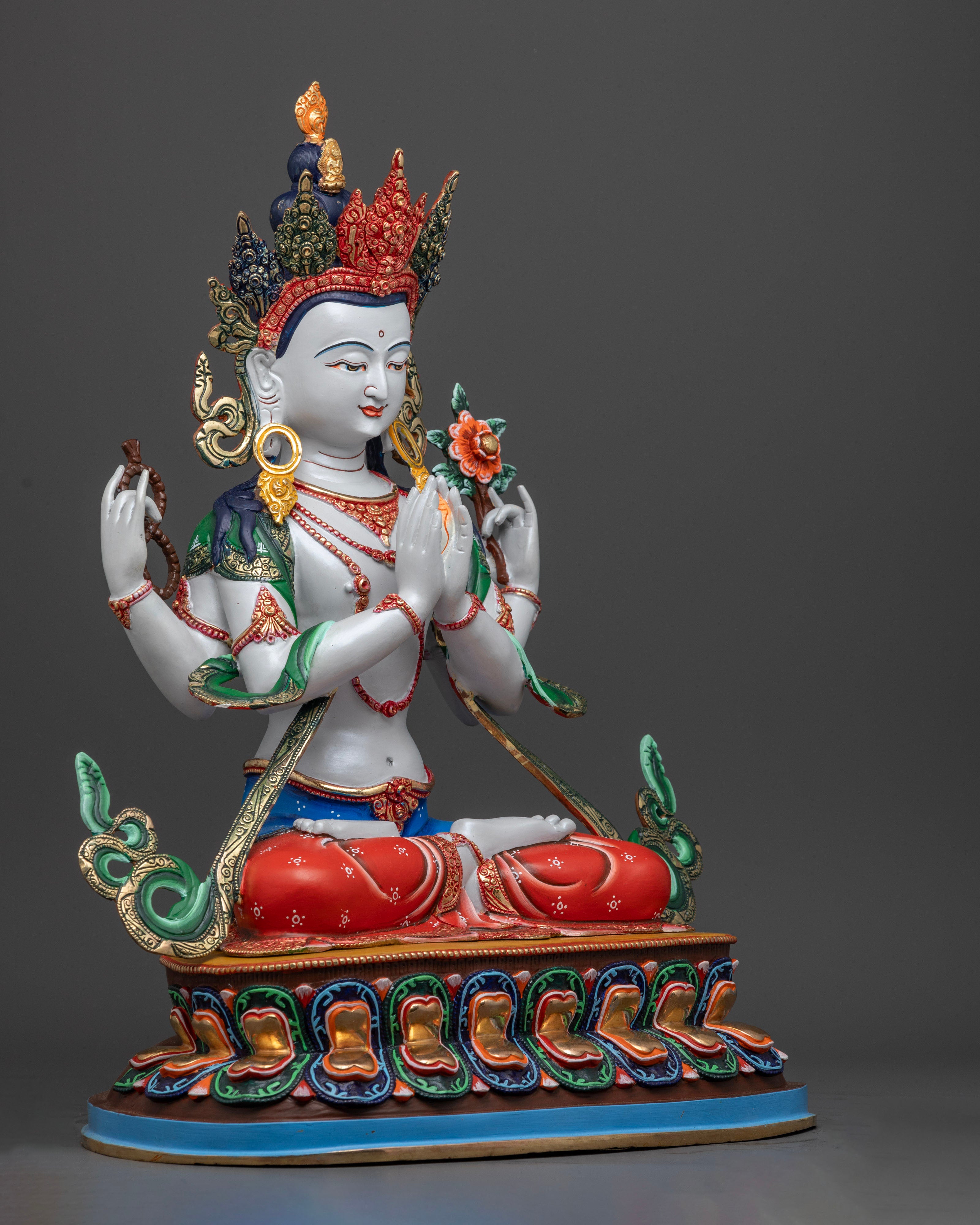 The 8.55kg Chenrezig statue, emphasizing the intricate detailing, colorful embellishments, and spiritual symbolism.