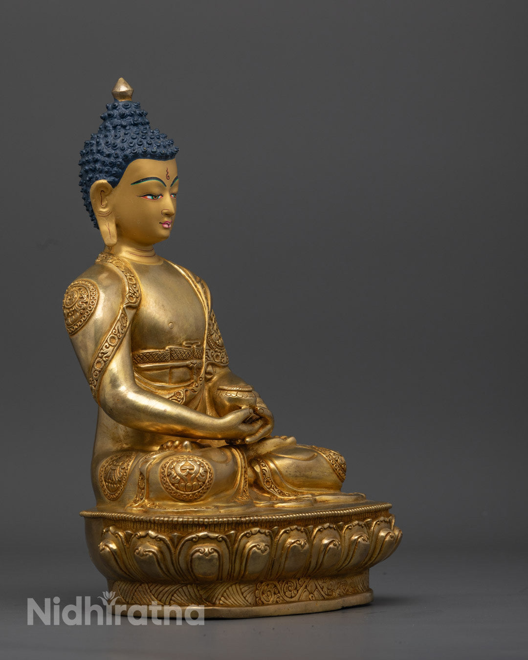 The Amitabha Buddha statue in 24K gold gilding, showcasing intricate details of the lotus throne and serene dhyana mudra, emphasizing purity and divine light