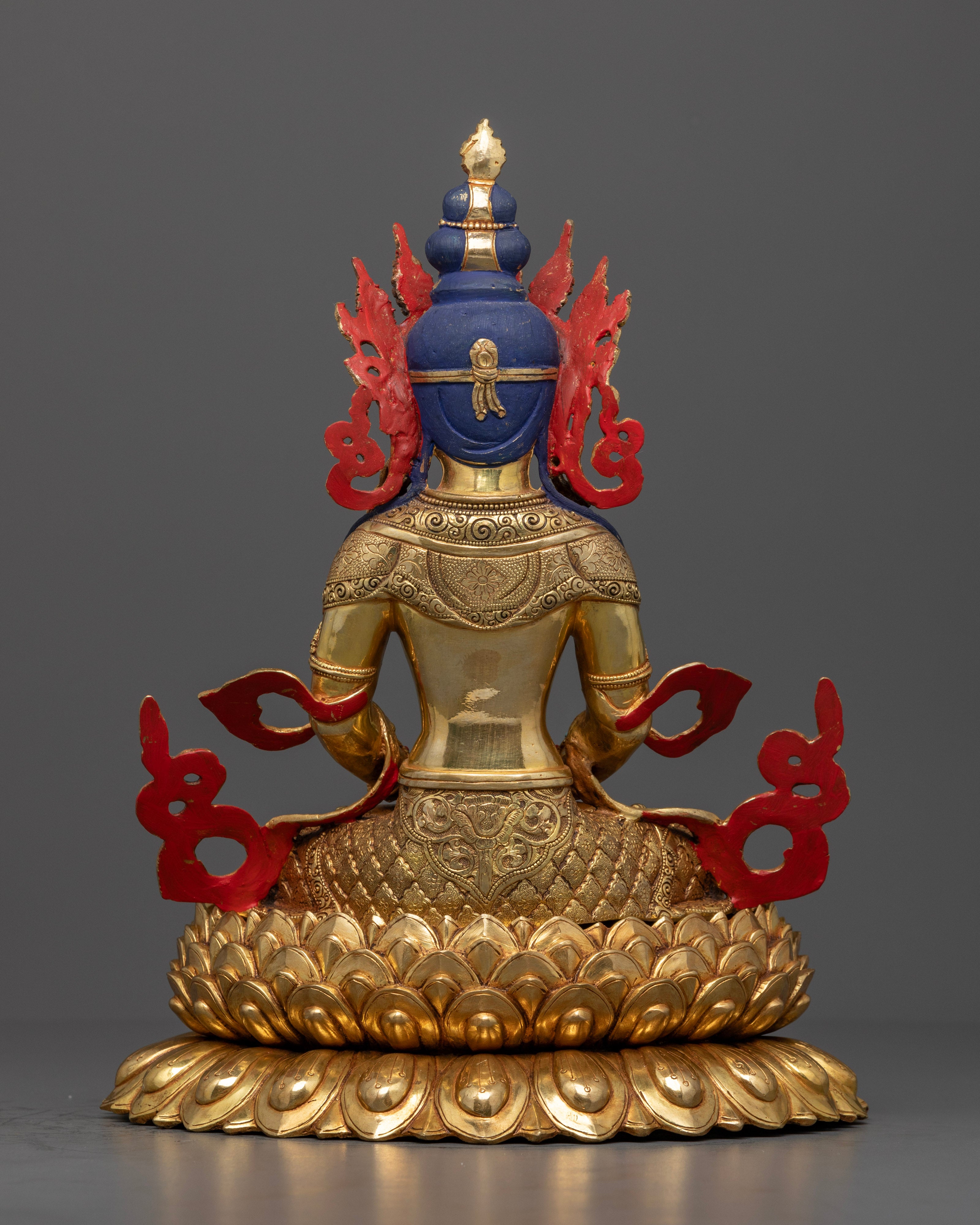 The Amitayus statue’s upper body, highlighting the serene face, ornate crown, and jewel-encrusted nectar vessel, symbolizing spiritual vitality, clarity, and the blessings of a long life.