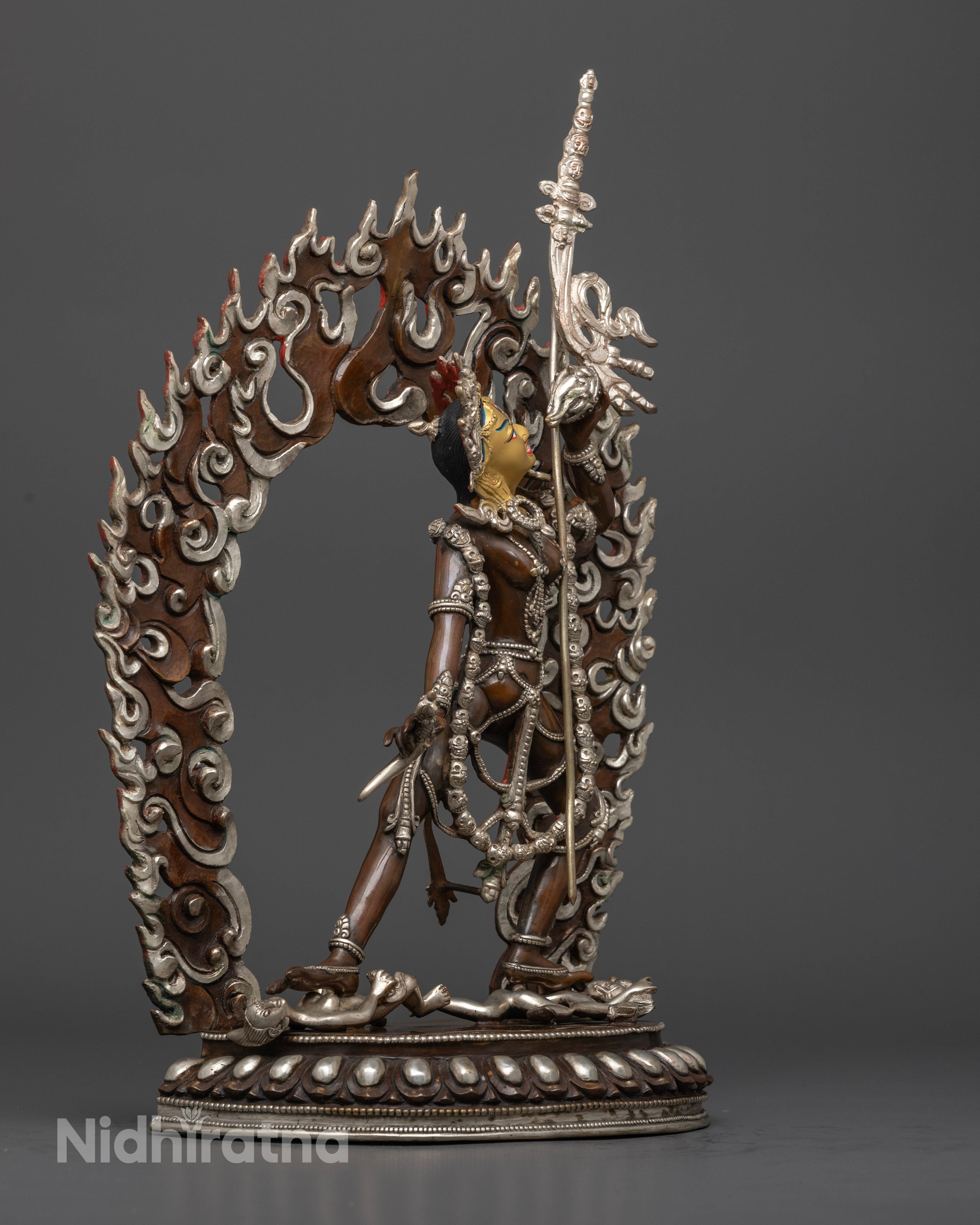 The oxidized and silver-plated Vajrayogini statue, showcasing the dynamic posture, intricate ornamentation, and vivid colors enhancing her divine energy and spiritual presence."
