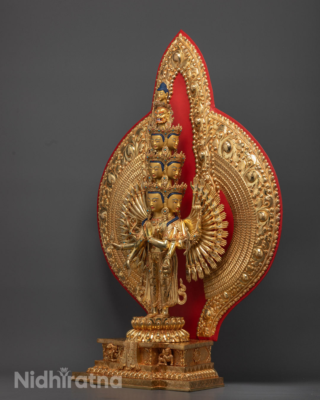1000-Armed Avalokiteshvara statue with gold-plated face, symbolizing infinite compassion and spiritual protection in Tibetan Buddhism.