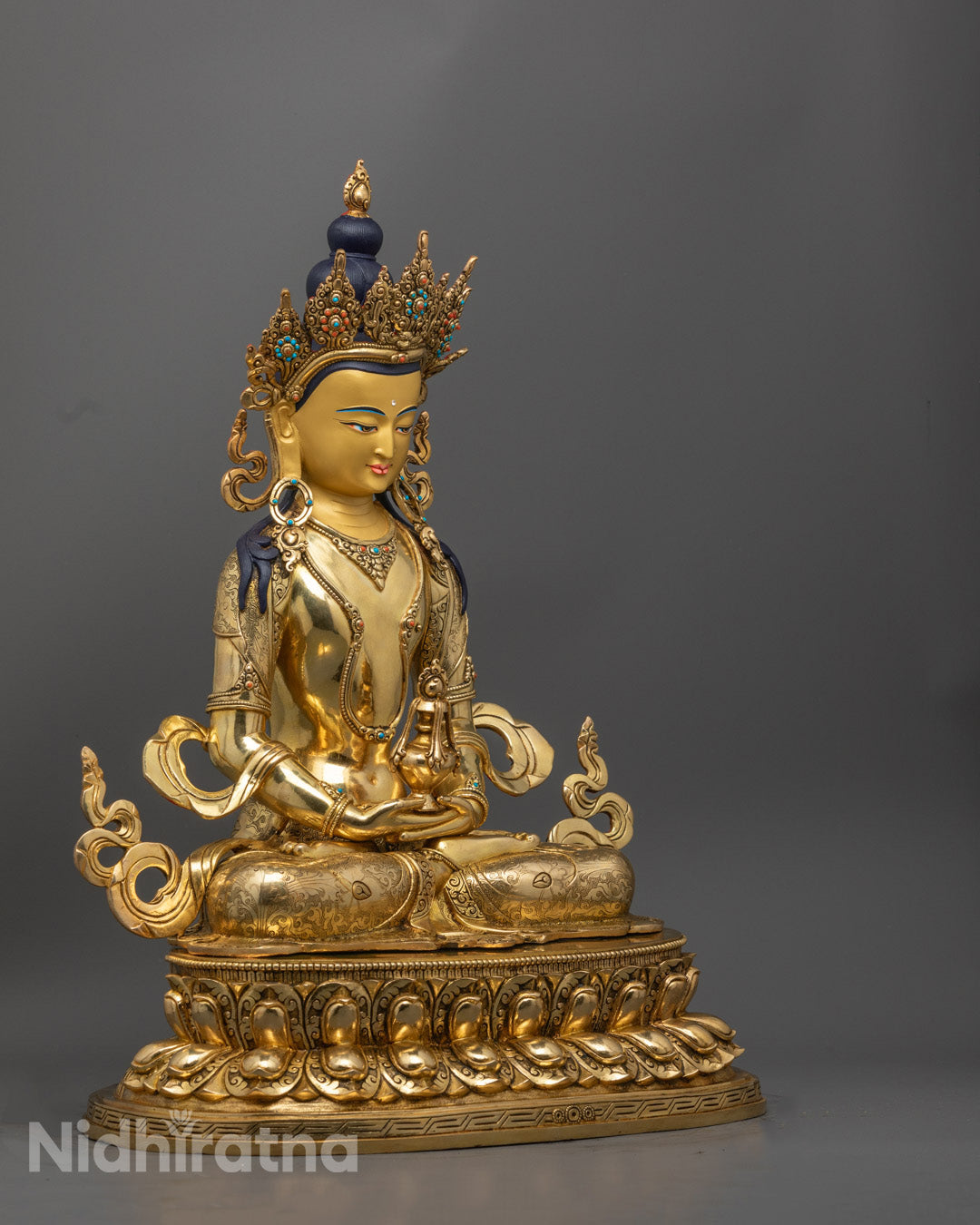 Tibetan Amitayus Buddha statue showing detailed robe patterns and serene facial expression, crafted using traditional lost wax technique.