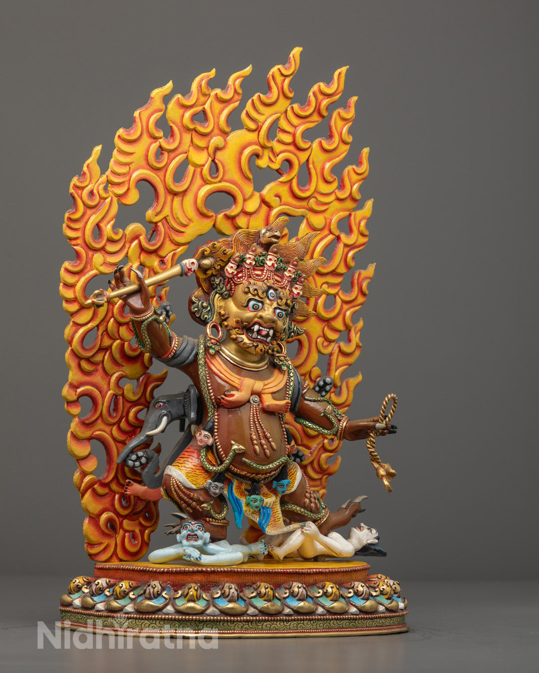 Tibetan Hayagriva Statue holding flaming trident with vajra handle and lasso, seated on lotus throne