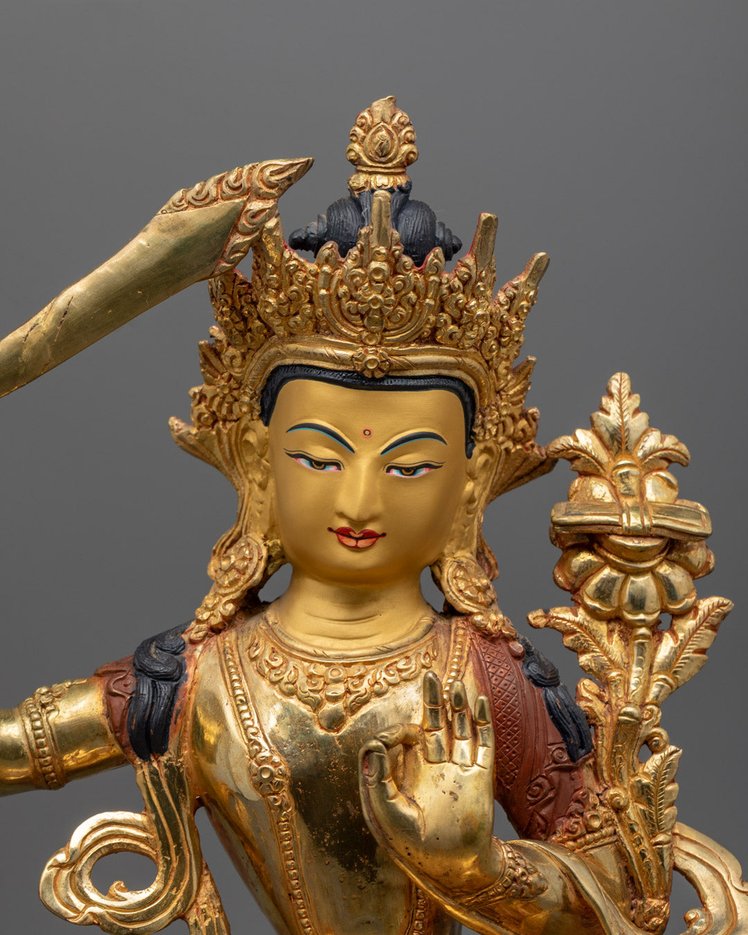 Tibetan Manjushri Bodhisattva Statue seated on lotus throne with wisdom sword and sacred scripture