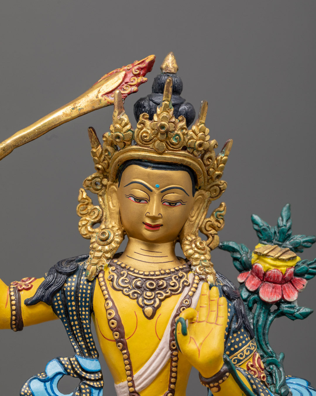 Tibetan Manjushri Statue in Yellow Acrylic Finish Seated on Multicolored Lotus Throne