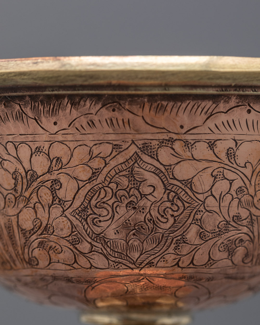 Top angle of traditional butter lamp showing artisan craftsmanship in copper