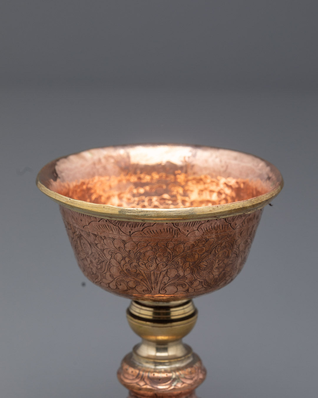 Top angle showing intricate hammered details on Nepalese copper butter lamp