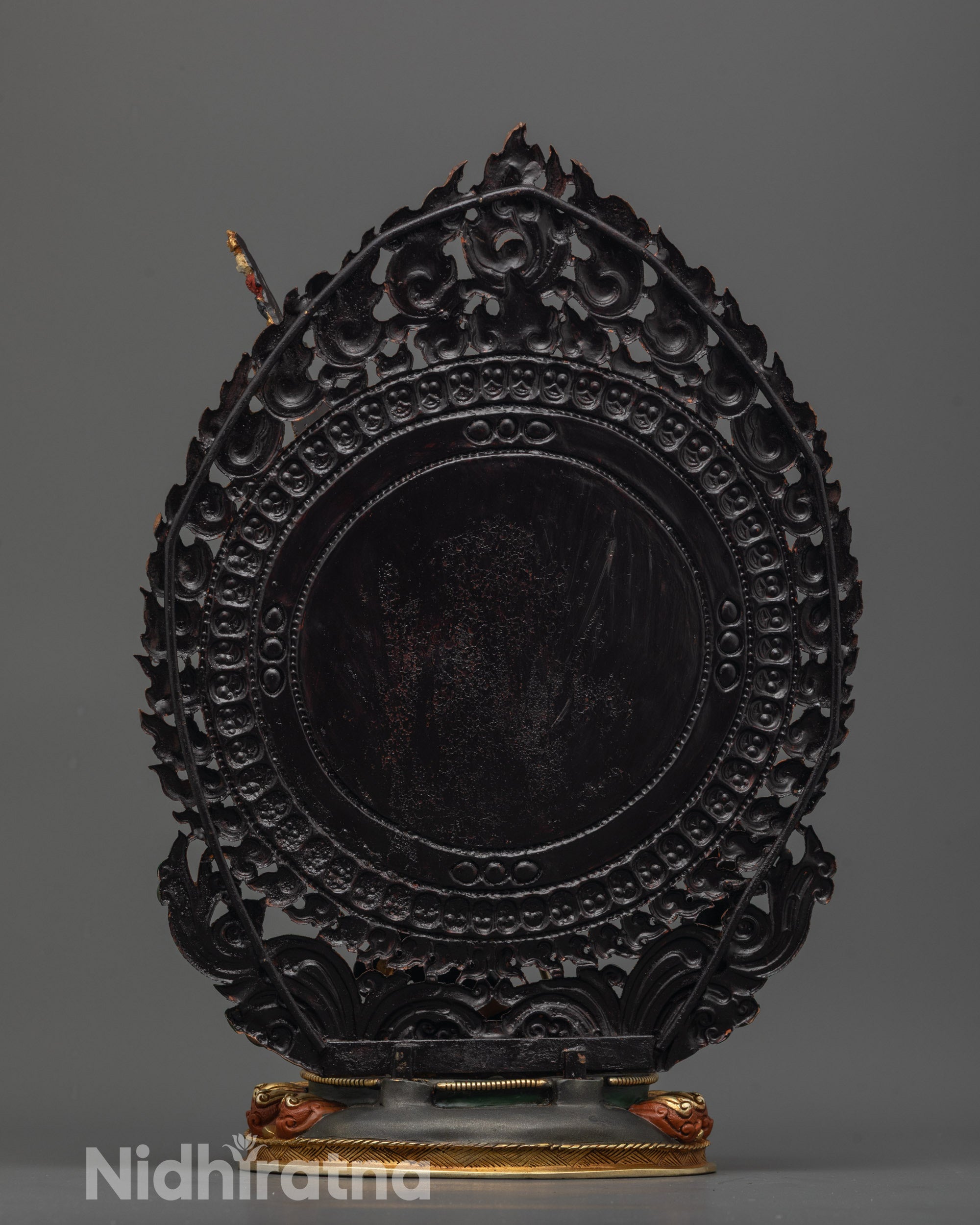 Top view of hand-carved Singha Mukha Statue highlighting hollow chamber