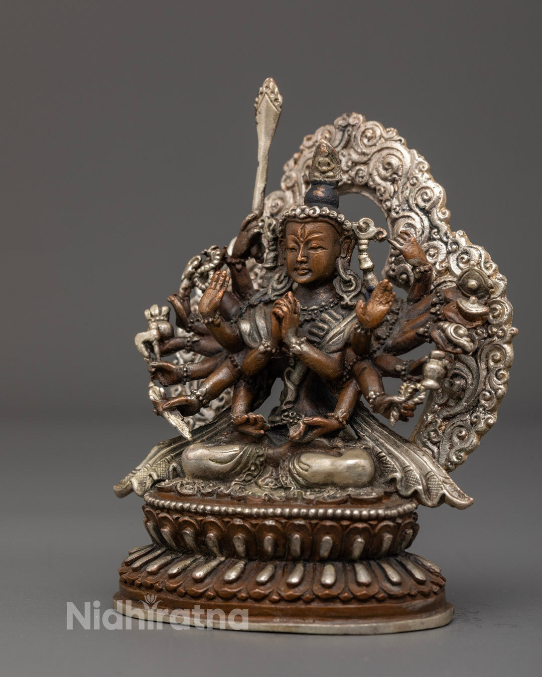 Traditional Chundi statue crafted by Nepalese artisans, featuring vibrant acrylic colors and silver finish, symbolizing feminine divine power.
