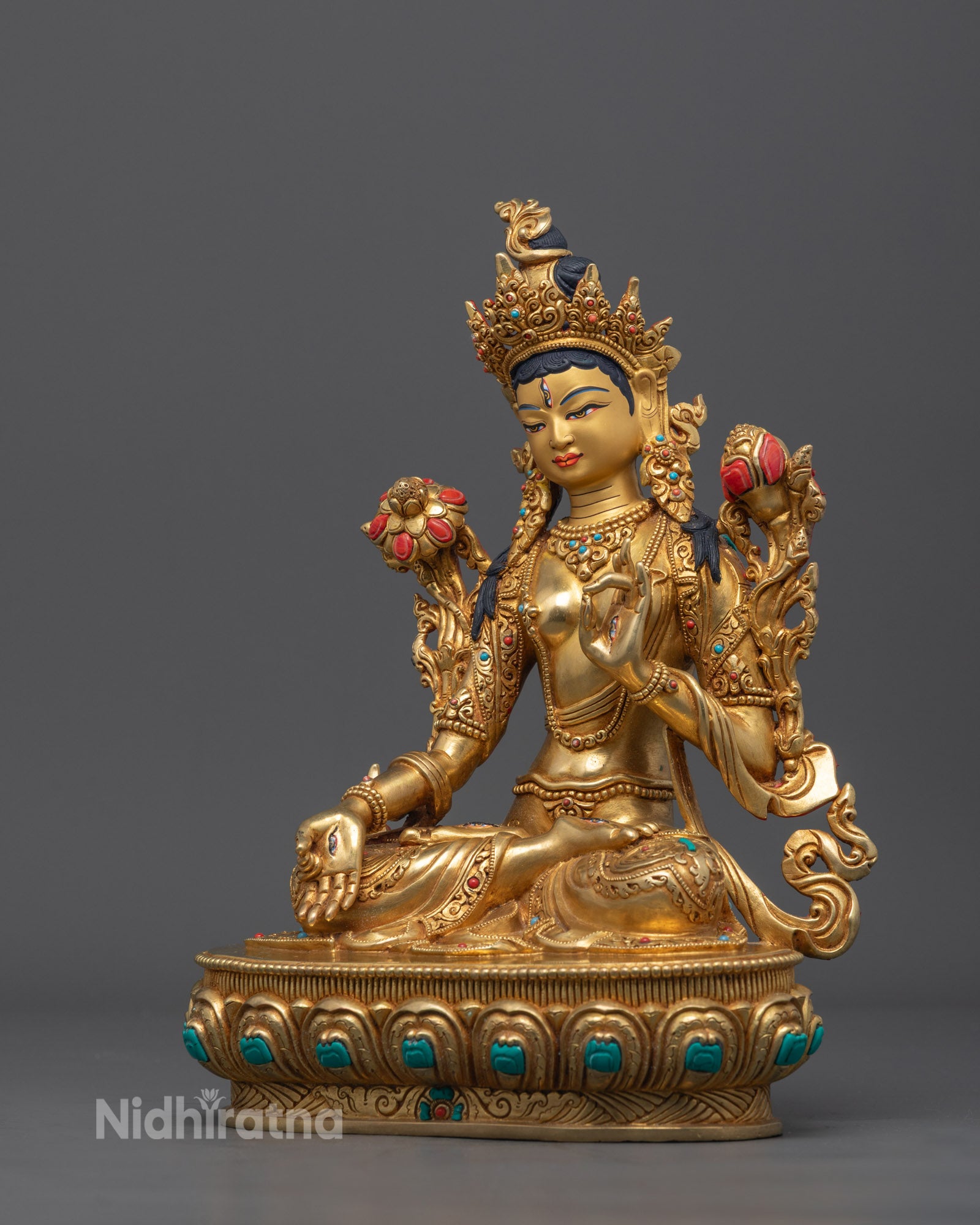 Traditional Nepalese artisan crafting a White Tara statue using the lost-wax method with intricate detailing on copper.