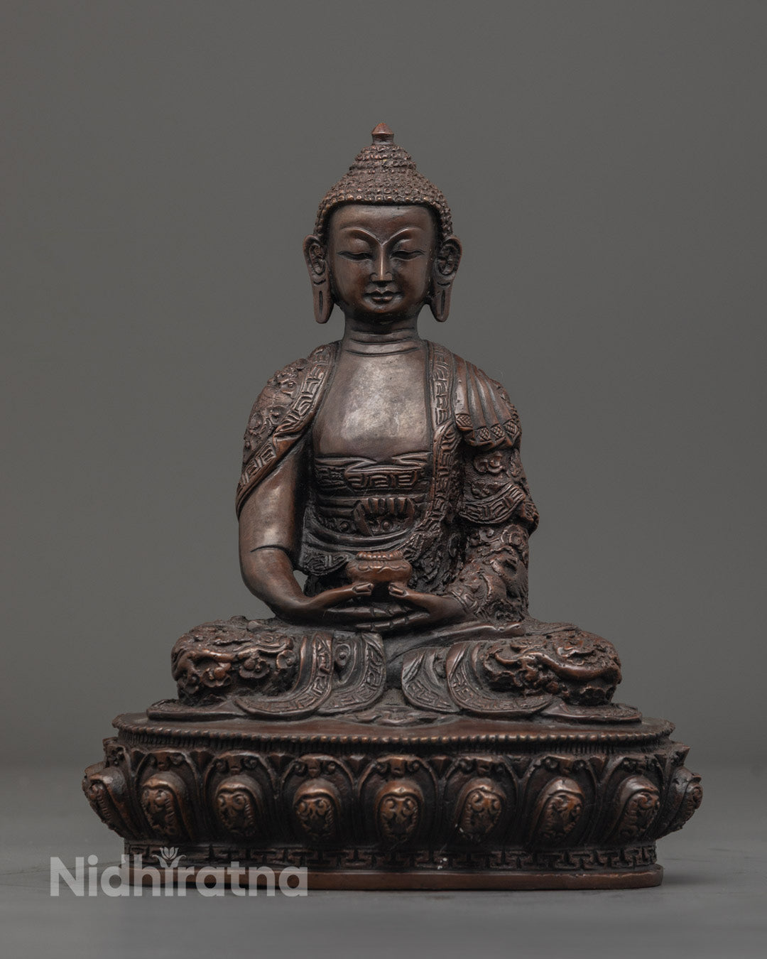 Traditional Nepalese artisan handcrafting the Three Buddha Statue Set using the ancient lost wax technique, showcasing meticulous carving and finishing.