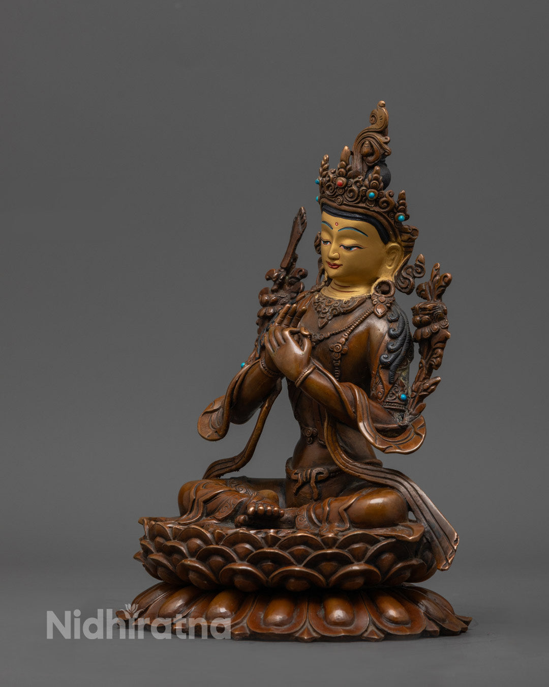 Traditional Tibetan Manjushri statue symbolizing wisdom, featuring lost wax carving details
