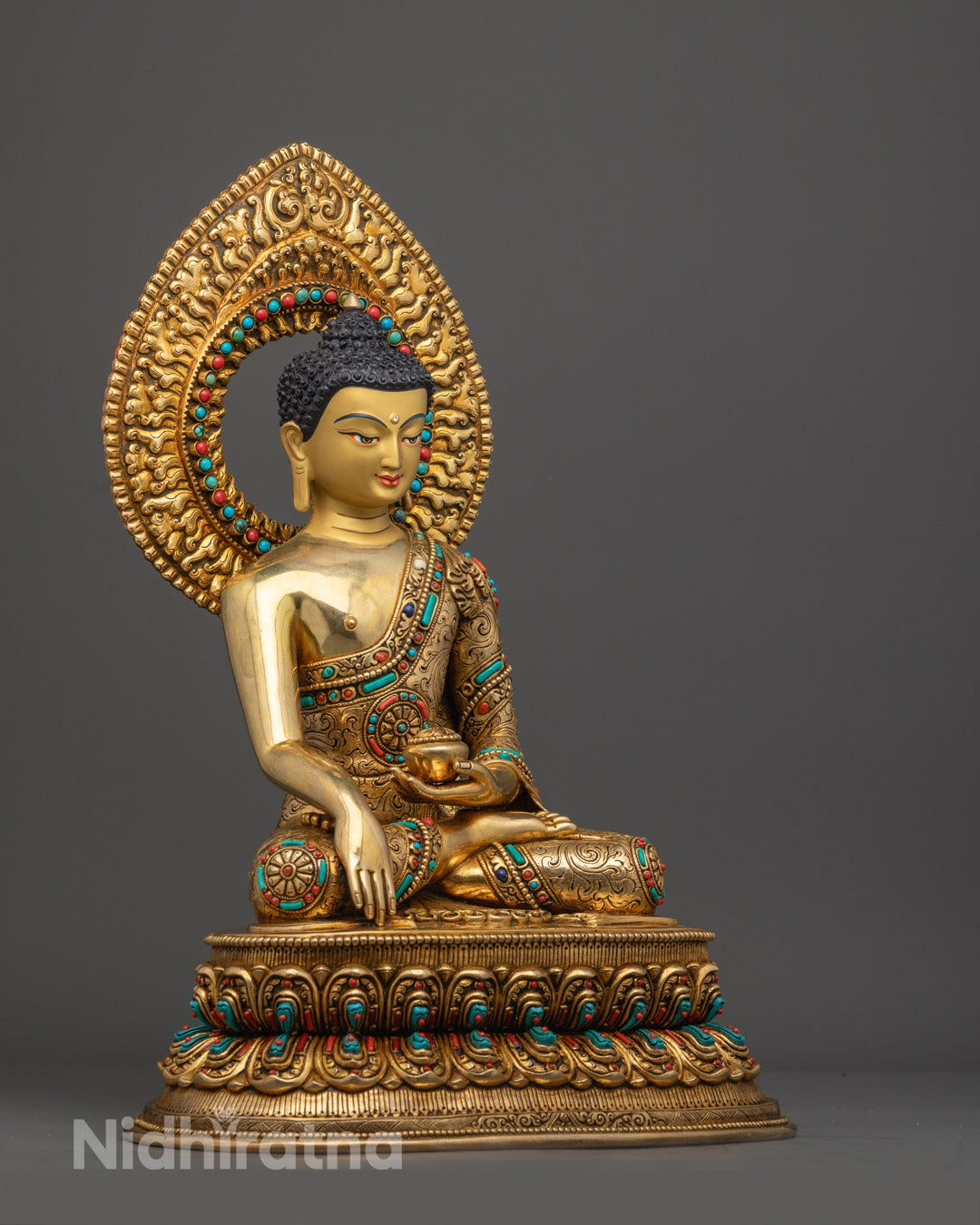 Traditional lost wax method crafted Shakyamuni Buddha statue adorned with semi-precious stones and fire-gilded gold accents