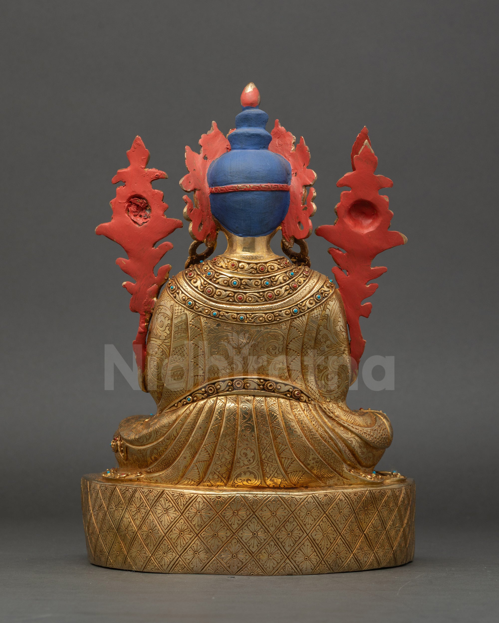 Trisong Detsen statue back view intricate patterned robes sculpture