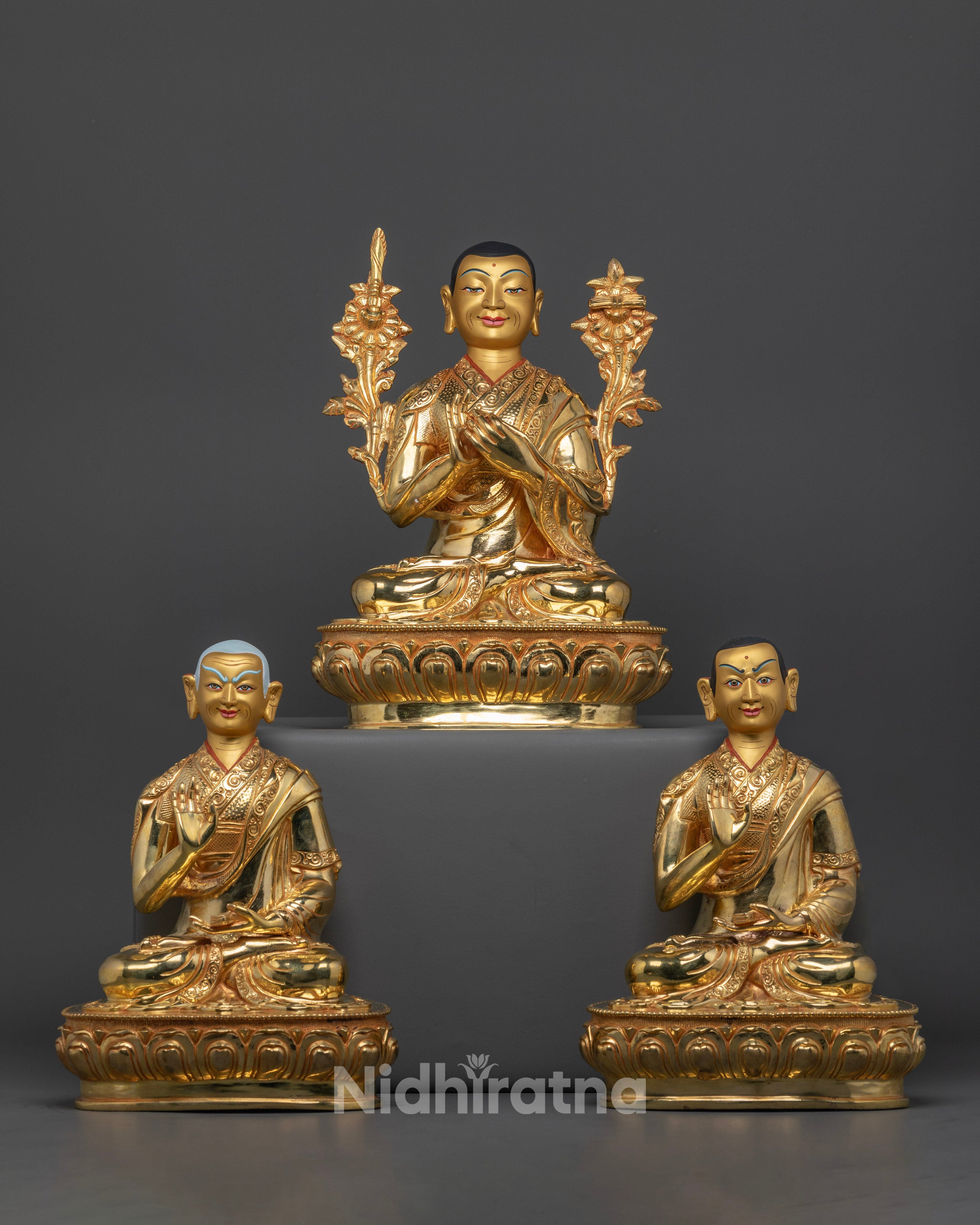 Tsongkhapa statue set, depicting Tsongkhapa seated in meditation on a lotus seat, holding the sword of wisdom and a lotus stem with the Prajnaparamita Sutra, flanked by his chief disciples Khedrup Je and Gyaltsap Je.