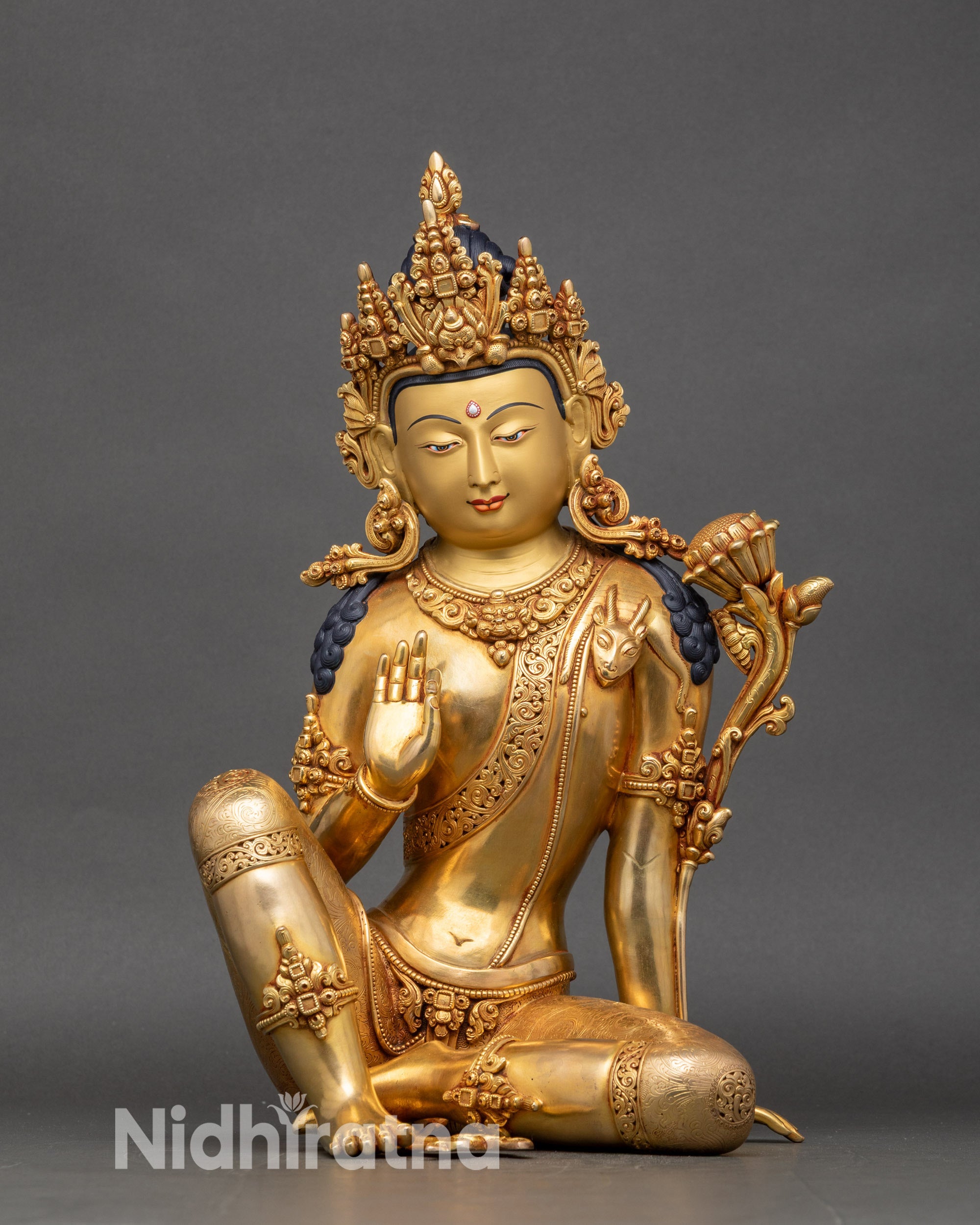 Two-Armed Chenrezig statue in lalitasana, gold fire-gilded copper from Nepal
