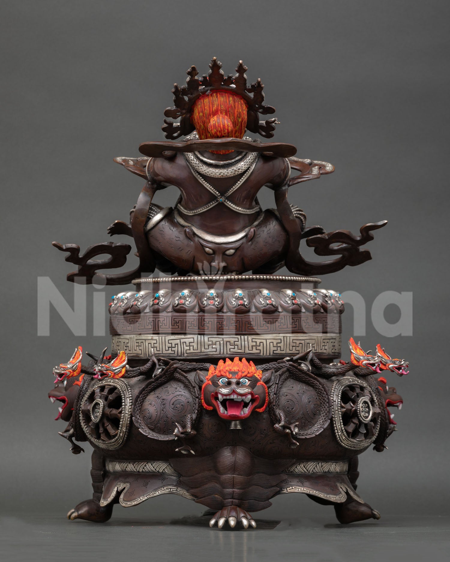 Vajradhaka statue back view Nepalese Buddhist sculpture inlaid stones silver plated finish meditation and protection art