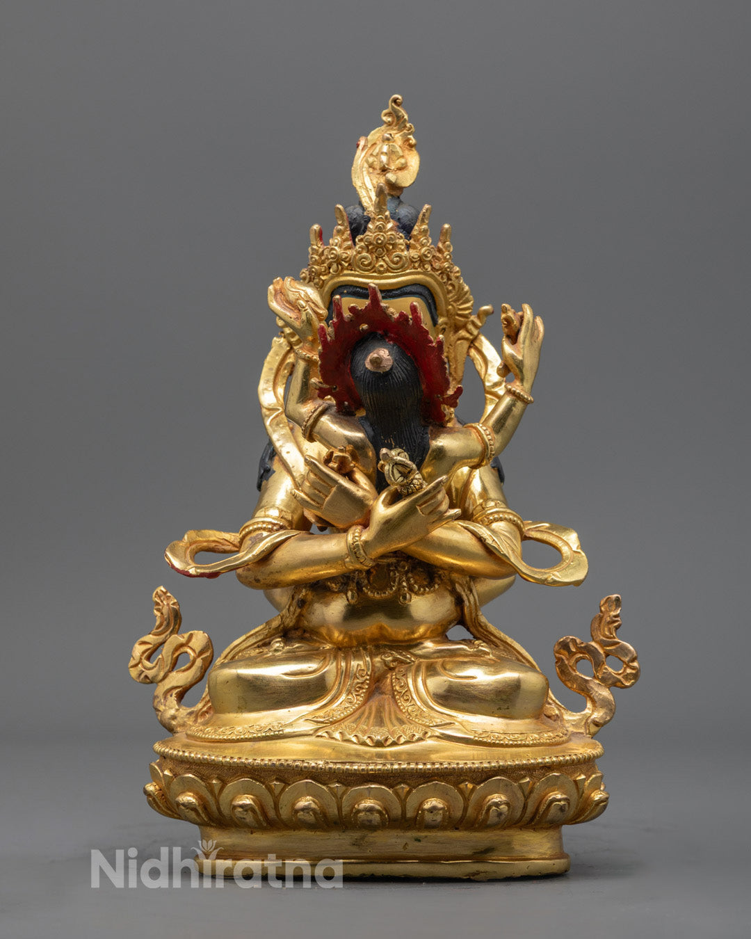 Vajradhara with Consort statue seated on a lotus throne, symbolizing enlightenment and primordial wisdom in Tibetan Buddhism.