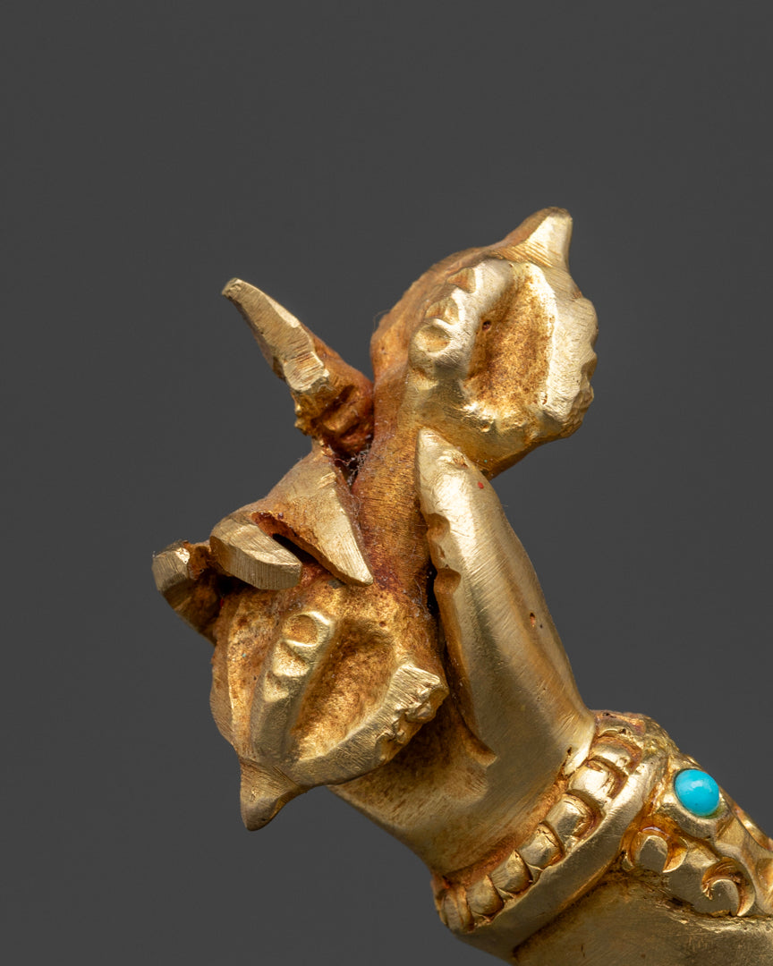 The right hand of gold plated vajrapani statue holding vajra | Intricate Vajrapani statue | Gold-plated Vajrapani statue